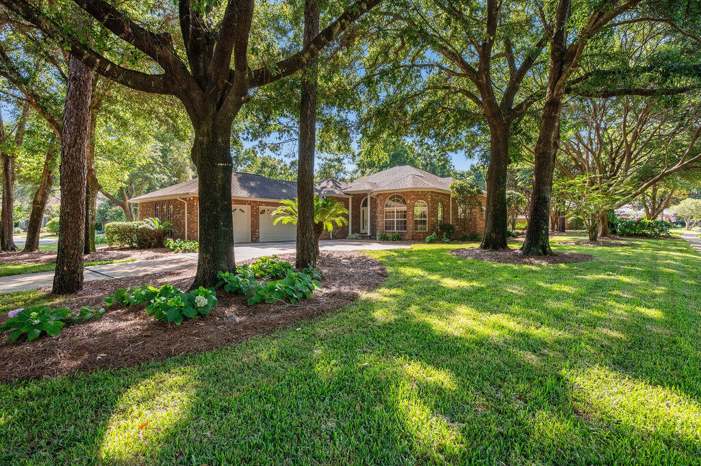 Come experience the quintessential Niceville lifestyle here at 300 Piney Creek Cv; a custom-built 3 Bedroom, 2 1/2 Bath single-level home, with an oversized 3-car garage, nestled on a desirable corner lot spanning nearly half an acre in the prestigious Swift Creek neighborhood where community charm meets unparalleled convenience.

This sought-after enclave is perfectly positioned for those seeking a balance of professional proximity and coastal leisure. From the moment you arrive, the manicured landscaping and quality architecture set a sophisticated tone that carries throughout every inch of this well-maintained residence.

Step through the front door to find a tumbled-marble entry wall that perfectly complements the warmth of the Australian chestnut wood floors. Just off the foyer, there is a spacious home office/flex space features floor-to-ceiling bay windows, with adjacent half-bath; perfect as a work-from-home office, playroom, or as an additional overnight guest room. The open-concept layout of the home features high ceilings throughout and a seamless flow between the dining areas and the expansive great room. Here, a custom fireplace and floor-to-ceiling sliding glass doors out to the sunroom/porch room create an inviting atmosphere for both quiet evenings and elegant entertaining.

The heart of the home is the gourmet kitchen, a chef's dream outfitted with custom cabinetry, premium stainless steel appliances--including a gas stove and wall oven - together with a cent er island. It opens to an oversized breakfast area and a comfortable living space accented by built-in shelving and designer finishes. For those seeking a true indoor-outdoor lifestyle, the "3-season" sunroom features Eze-Breeze bronze-tinted windows, offering a tranquil spot to enjoy the breeze without the elements, leading out to an expansive patio perfect for summer grilling.

The large primary suite serves as a private retreat, complete with a sitting area and a spa-inspired bathroom featuring dual vanities, a whirlpool tub, separate shower, and an oversized walk-in closet. The split floor plan ensures privacy for guests or a home office, while the functional laundry room provides ample cabinetry and workspace.

Beyond its aesthetic appeal, this home is engineered for peace of mind and convenience. It boasts a whole-house Generac generator (recently serviced) that protects the entire property automatically, an oversized 3-car garage to house all your outdoor gear, a whole-house vacuum system, and abundant attic storage. A brand new HVAC system and water heater have just been installed, and a new 3-dimensional shingle roof will be installed prior to closing with acceptable offer.

Residents also enjoy the world-class amenities of Swift Creek, including a gorgeous clubhouse, swimming pool, tennis courts, basketball court, park, and scenic nature trails. This is more than just a home; it is a refined lifestyle waiting for its next chapter!

Families will appreciate being within the footprint of Niceville's top-performing, A-rated schools, while military professionals will enjoy a seamless commute to Eglin Air Force Base, 7th Group HQ, Duke Field, and Hurlburt Field Air Force Base, and in close proximity to the i10 interstate corridor just to the north.

Beyond the neighborhood's peaceful manicured streets, the best of the Emerald Coast awaits! You are just a short drive from the world-famous sugar-white sands and emerald waters of Destin and the scenic beauty of 30A. Whether you're spending a quiet afternoon under the neighborhood's towering oaks or heading out for a day of luxury on the Gulf, Swift Creek offers the perfect home base for a life of convenience within an upscale sought-after community. Don't delay in making this beautiful home yours!