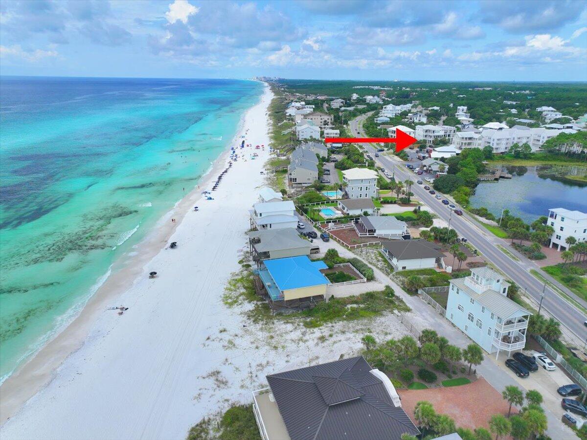 This expansive, to-be-built beach house will feature a custom design tailored specifically to the buyer's needs. The thoughtfully planned layout includes a private garage, five bedrooms, and two versatile loft spaces. To maximize outdoor coastal living, the home also boasts a generous back patio and a spacious second-level balcony.