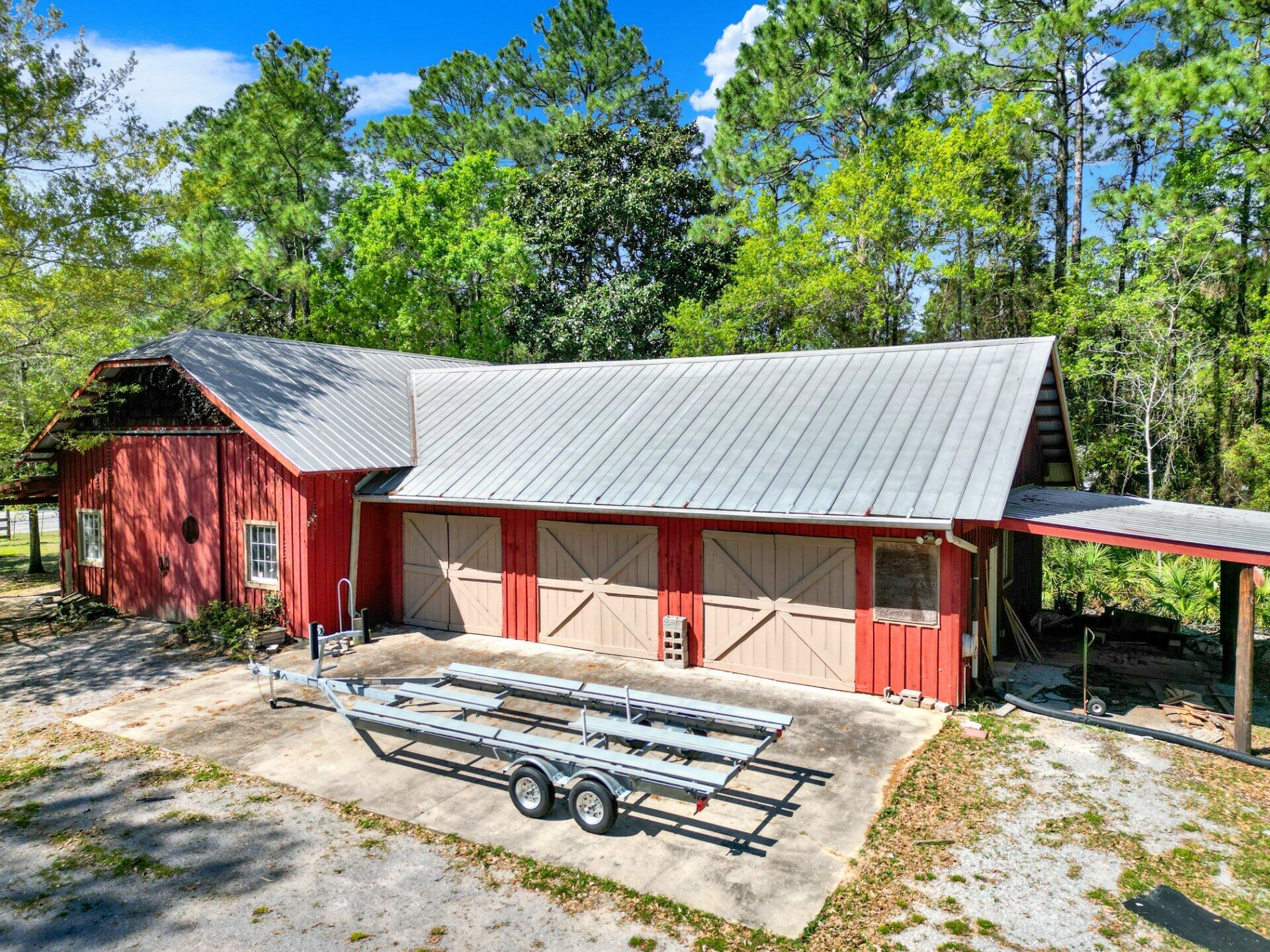This property sits on a three lot site with a large open floor plan that acts as a perfect space to turn into a barndominium or use to store your antique car collection. With a second floor loft  for storage and other uses. High ceilings and close proximity to Hogtown Bayou. There is plenty of space no matter what kind of toys you prefer. Property already has access to water and sewer. Give us a call to schedule your showing today.
