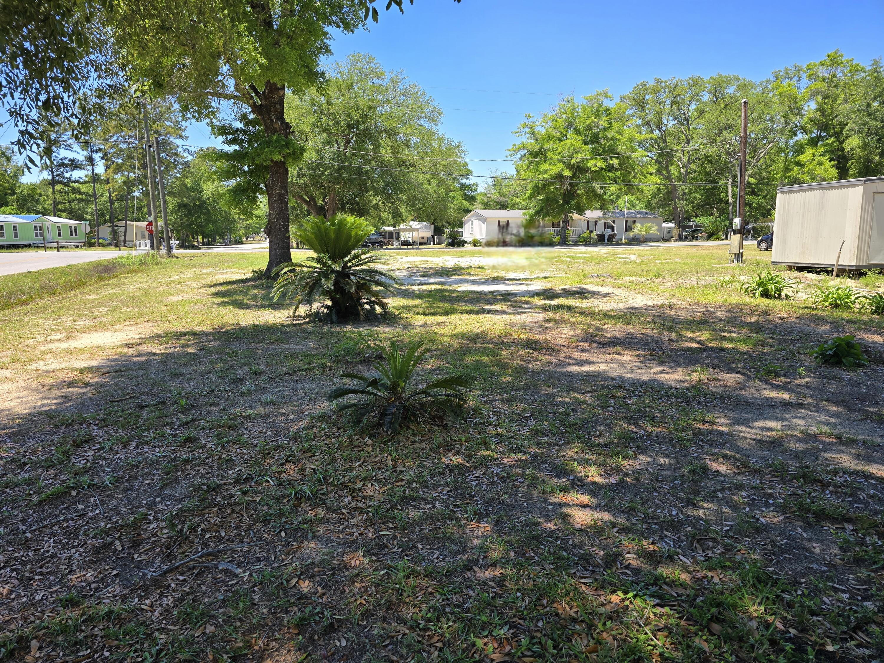 Prime opportunity in growing Freeport, FL! This flat, clear corner lot is ready for your new home or investment. Ideally located less than a mile from shopping and dining, and approx. ½ mile from US-331 & Hwy 20, offering easy access north and south. Enjoy the convenience of nearby amenities while being under 30 minutes from the white sandy beaches of the Gulf. Bring your builder, no clearing or delays!