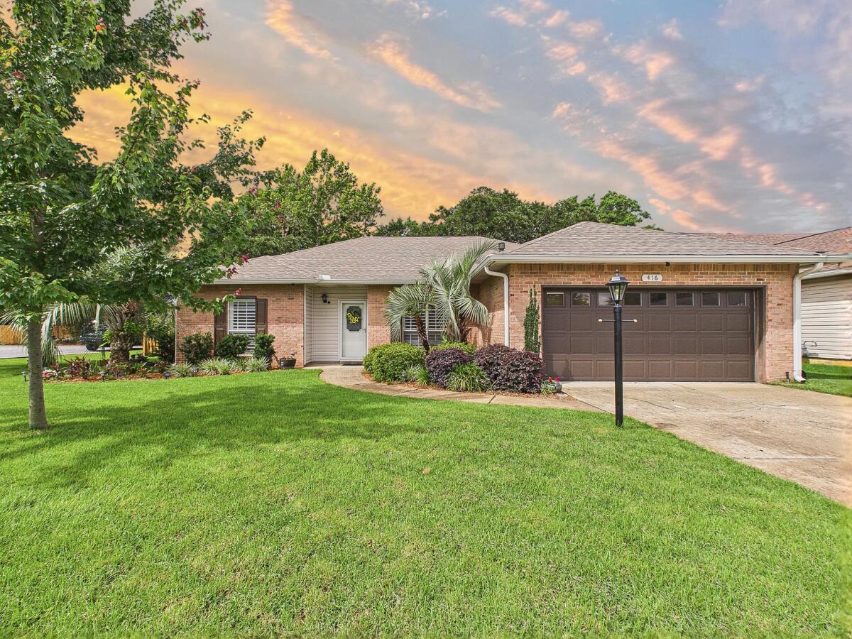 Tucked away on a quiet, private cul-de-sac in Parkwood Place, this beautiful all-brick Bluewater Bay home is an absolute must-see! It features a bright, wide-open layout with high cathedral ceilings, smooth finishes, beautiful laminate hardwood floors, and a spacious living room centered around a cozy gas fireplace. The layout gives everyone plenty of space, featuring a private master suite with his-and-hers mirrored closets on one side, and two roomy guest bedrooms on the other. Plus, all three bedrooms are getting brand-new carpet installed right before showings start! One of the coolest parts of the house is the massive sunroom, lined with windows that look out over a gorgeous, lush backyard with mature trees. You also get fantastic practical perks like a 2021 roof, 2019 water heater, 2016 HVAC, hurricane shutters, full irrigation, a finished two-car garage with a hot/cold utility sink, and the washer and dryer convey with the sale! Best of all, you are just a short distance to Bluewater Elementary and local shops, and minutes from the marina, golf courses, and Destin beaches. Carpet is being laid on Wednesday, 6/3, so there are absolutely no showings until Thursday, 6/4. Come take a look!