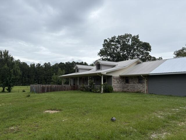 Welcome to country living at its finest! If you've been searching for the perfect blend of peaceful surroundings, usable land, and endless potential, this incredible property is ready to make your dreams a reality. Nestled on approximately 9 beautiful acres, this one-of-a-kind property offers the ideal setting for horse enthusiasts, hobby farmers, outdoor lovers, or anyone looking to enjoy the privacy and freedom that only country living can provide.

The true centerpiece of this property is the impressive 32' x 60' barn, complete with horse stalls and ample space for equipment, hay storage, or additional livestock. Whether you're an experienced equestrian or simply looking for room to grow, you'll appreciate the functionality and versatility this barn provides. In addition, the property features a detached garage/workshop with an attached covered carport, making it perfect for mechanics, woodworkers, small business owners, or anyone needing extra storage for vehicles, boats, tractors, or recreational equipment.

The home offers a comfortable 3-bedroom, 2-bath split floor plan designed with both privacy and functionality in mind. While the interior could benefit from cosmetic updates, it provides an excellent opportunity to personalize the home and build equity while creating the country retreat you've always envisioned. The spacious family room is perfect for those gathering with family and friends with an access to the oversized back porch. A must see!!!