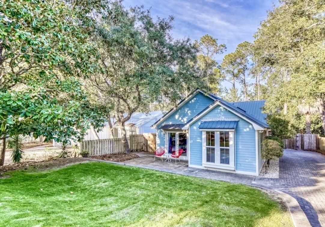 You found it!  Private oasis with pool, one minute bike ride to the beach, well under $2 Million, in the heart of 30A.  Seaside is all yours with just a two minute spin on your bicycle.  A substantial refresh has made 100 Canal a must see!  New Floors, bathroom, and kitchen counters provide a crisp, inviting feel to this perfect getaway or full time home.  Offered fully furnished.  Step out from the living room with vaulted ceiling into a much larger than average back yard with proportional private swimming pool.  As this beach home backs up to woods, feel free to enjoy your privacy!