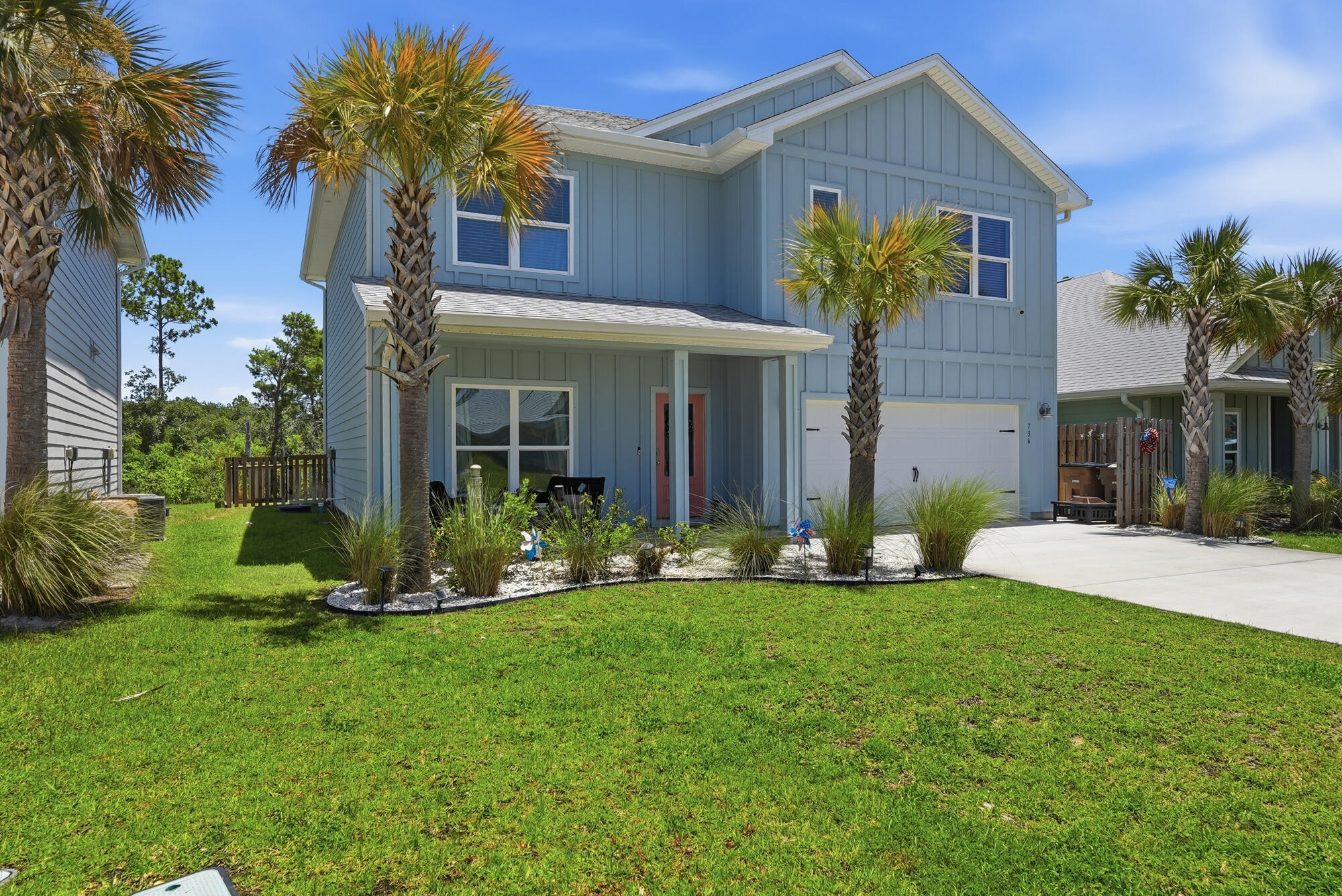 Welcome to 736 Backwater Road, where modern coastal living meets the laid-back lifestyle of WindMark Beach. This beautifully designed 5-bedroom, 3-bath home offers more than 2,500 square feet of thoughtfully planned living space, making it an exceptional choice for a primary residence, vacation retreat, or investment property along Florida's Forgotten Coast. Don't worry about a golf cart, because one is included in the sale! Inside discover an open-concept floor plan filled with natural light, where the spacious living, dining, and kitchen areas blend seamlessly to create the perfect setting for everyday living and entertaining. The well-appointed kitchen features generous workspace, abundant cabinetry, and an oversized island ideal for gathering with family and friends. The thoughtfully designed layout provides comfortable accommodations for family and guests alike, with spacious bedrooms and flexible living areas that easily adapt to your lifestyle. Outside, unwind on the covered patio while enjoying the peaceful coastal atmosphere, or take advantage of the attached garage with ample room for vehicles, golf carts, bicycles, paddleboards, and all your beach essentials. Every detail has been designed to complement the relaxed coastal lifestyle that makes WindMark Beach so desirable. Great location and only 1200 ft from Good Morning St. which is the heartbeat of Windmark, where residents can enjoy outstanding community amenities including resort-style pools, scenic walking and and biking trails, boardwalks, fitness facilities, playgrounds, and convenient beach access. The vibrant WindMark Beach Town Center offers dining, shopping, and community events just moments from your doorstep, while historic downtown Port St. Joe, St. Joseph Bay, world-class fishing, boating, kayaking, and the sugar-white beaches of the Gulf of Mexico are only minutes away. Great investment opportunity to enjoy the unmatched charm of Gulf County's coastal lifestyle.