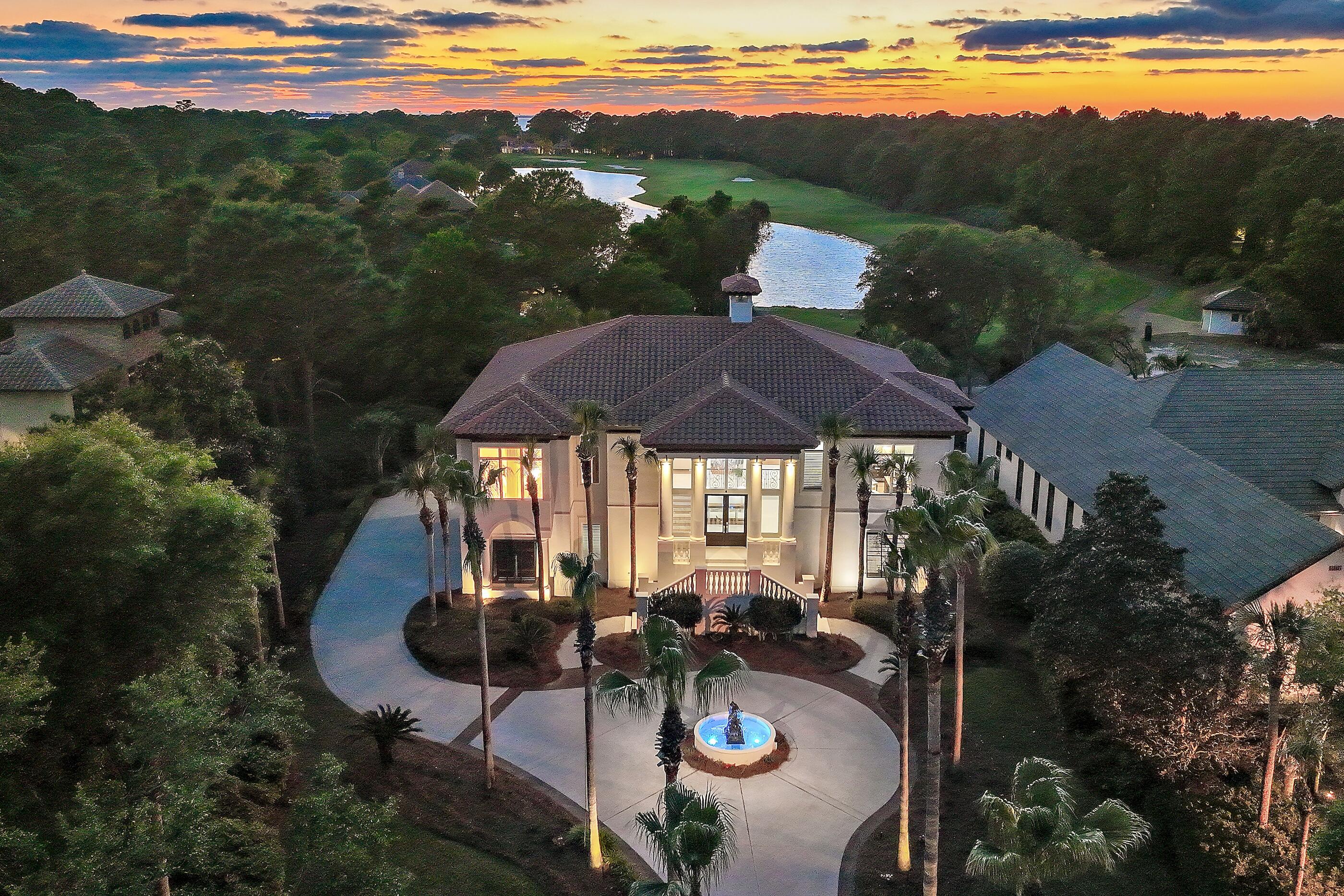 Burnt Pine | Sandestin Golf & Beach Resort | 4 Bedrooms | 6.5 Bathrooms | 4,680 SF | 0.56 Acres | Private Elevator | Golf Course Views  
2 story home located in the Burnt Pine neighborhood of Sandestin Golf & Beach Resort. This property is situated on approximately 0.56 acres and offers 4,680 sq ft of living space. A palm-lined circular driveway leads to the home's façade, with landscaped grounds and maintained exterior spaces. New saltwater softner and carbon filter just installed for sprinkler system. New Well Pump.
The home includes a private elevator from the garage to the second level, hurricane-rated impact shutters, and high ceilings. The kitchen features quartz countertops, custom cabinetry, built-in microwave, and large p A palm-lined circular driveway and beautifully maintained grounds create a grand arrival, setting the tone for the elegance found throughout the home. Inside, soaring ceilings and expansive living areas provide a sense of openness and sophistication, while a private elevator offers effortless access from the garage to the second level -- a rare and highly desirable feature for comfort and convenience. Hurricane-rated impact shutters provide peace of mind, and a newly installed saltwater softener and carbon filtration system enhance the irrigation for lush, well-maintained landscaping year-round.

The kitchen is designed to gather and impress, featuring quartz countertops, custom cabinetry, updated hardware, built-in microwave, and a generous pantry. Updated lighting and beautifully renovated bathrooms throughout the home reflect a clean, refined aesthetic that blends comfort with modern coastal style.

The primary suite serves as a peaceful retreat, offering serene golf course views, a spacious walk-in closet, and a beautifully updated bath designed for relaxation. Three additional junior suites provide private accommodations for family and guests, while a dedicated office or study creates the perfect space for remote work or quiet reflection.

Outdoor living is equally captivating. The resurfaced pool with new gunite finish creates a true resort-style setting, while the screened porch overlooks the 5th hole of Burnt Pine Golf Course -- offering tranquil views and a perfect setting for entertaining or unwinding in the coastal breeze. A three-car garage and generous additional parking provide both function and convenience.

As part of Sandestin Golf & Beach Resort, residents enjoy access to an unparalleled coastal lifestyle, including championship golf, pristine sugar-white beaches, a full-service marina, dining, shopping, and 24-hour gated security -- all within one of the Emerald Coast's most sought-after master-planned communities.

For the discerning buyer seeking space, privacy, and elevated golf course living in a premier resort environment, this Burnt Pine estate presents an extraordinary opportunity to experience the very best of luxury living along Florida's Emerald Coast.