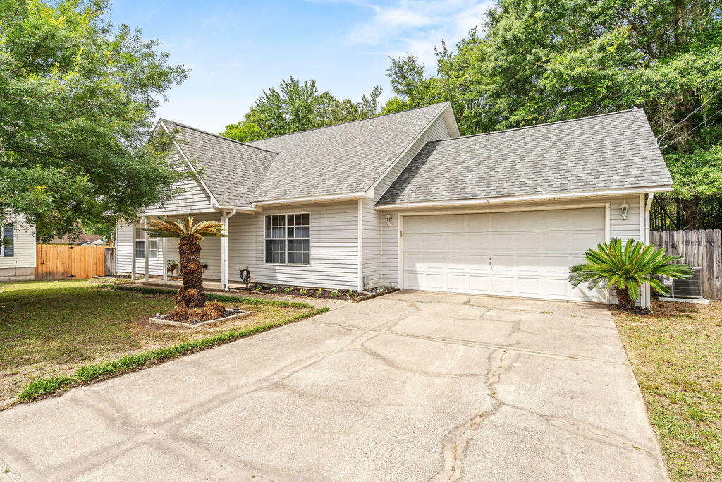 Tucked away in a quiet cul-de-sac, this inviting home offers comfort and convenience just minutes from restaurants, shopping, schools, and military bases. Inside, you'll find a bright open living area with vaulted ceilings and wood-look vinyl flooring. The spacious kitchen features ample cabinet space, a pantry, and tile flooring. The split floor plan provides added privacy with the primary suite located downstairs and featuring a double vanity in the en-suite bath. Secondary bedrooms are carpeted for comfort, while the main living areas are low-maintenance and stylish. Enjoy relaxing or entertaining on the backyard deck. Major updates include a new roof installed in July 2020 and a water heater replaced in 2021. HVAC 2026. Call today!