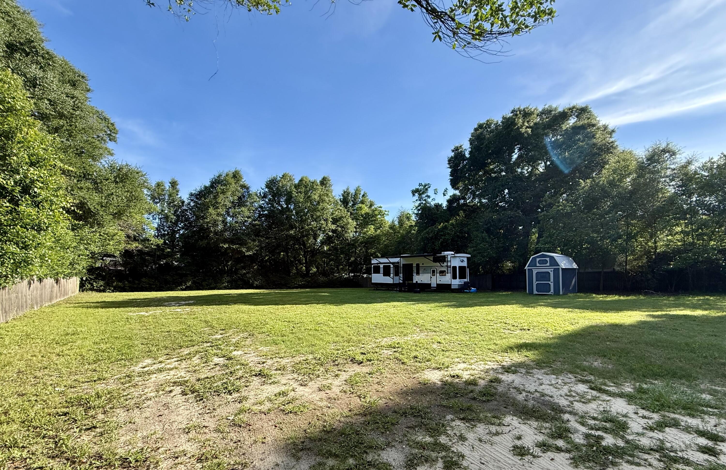 Wanting privacy but still want to be close to schools, shopping and work? This is the land for you! Privacy fenced on the boundary, new 8x12 shed included, water, septic and power already on site! Lower county taxes.