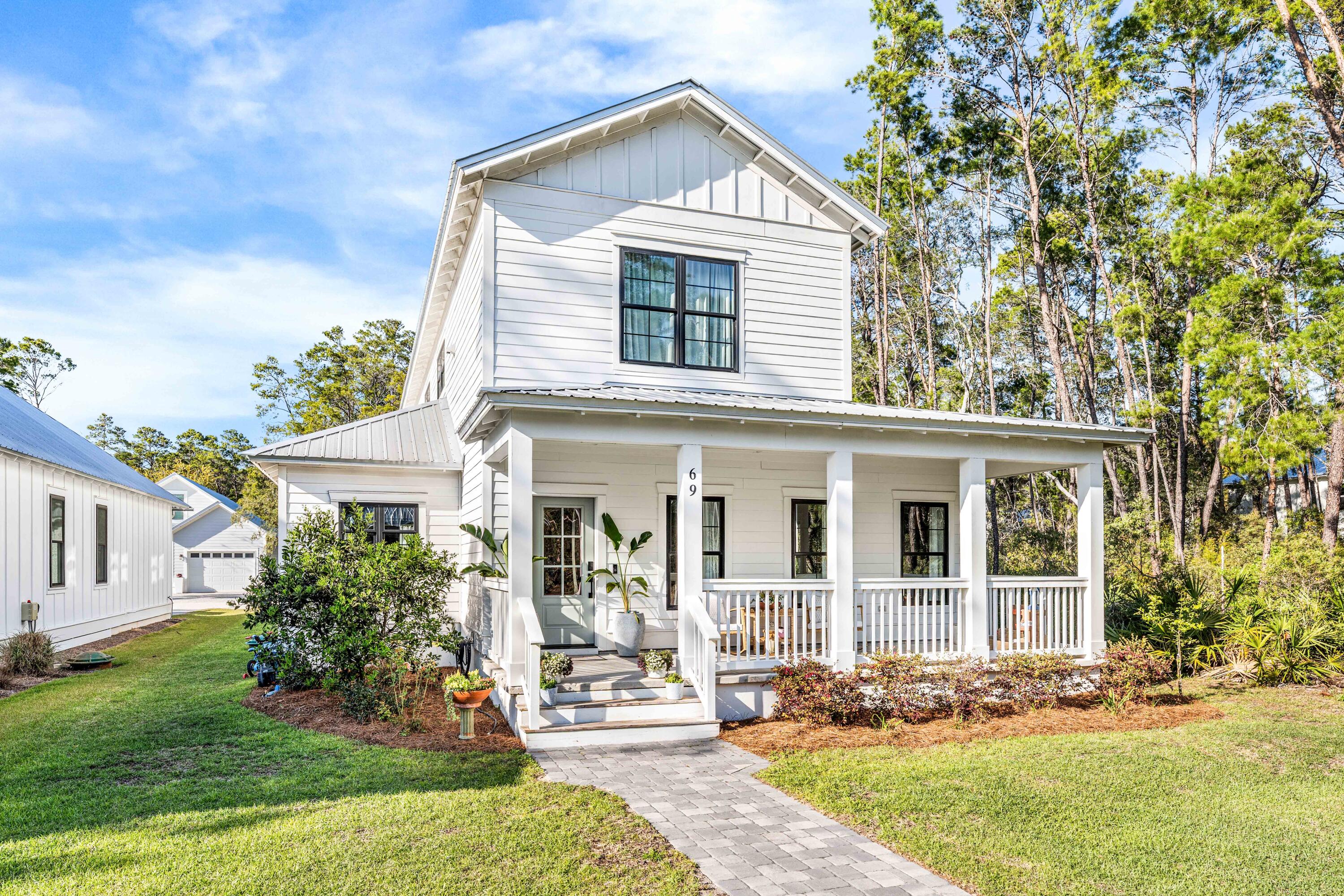 Located in the desirable Grayton Bayou neighborhood, 69 Devlieg Ave is one of the larger homes in the community, offering 4 bedrooms and 3.5 bathrooms across two levels. Just steps from the community pool & Bayside Ranchettes Park, the home features washer and dryer hookups on both floors. The first-floor primary suite is located off the kitchen and includes a double-vanity bathroom with two closets. Upstairs offers three additional bedrooms, two full bathrooms--including a Jack-and-Jill with separate vanities--and a landing ideal for a sitting area or playroom. A generous side yard provides space for grilling, pets, or a playground. The property also includes a two-car garage with additional parking behind the garage. Ideal for full-time living or a second home near Grayton Beach.