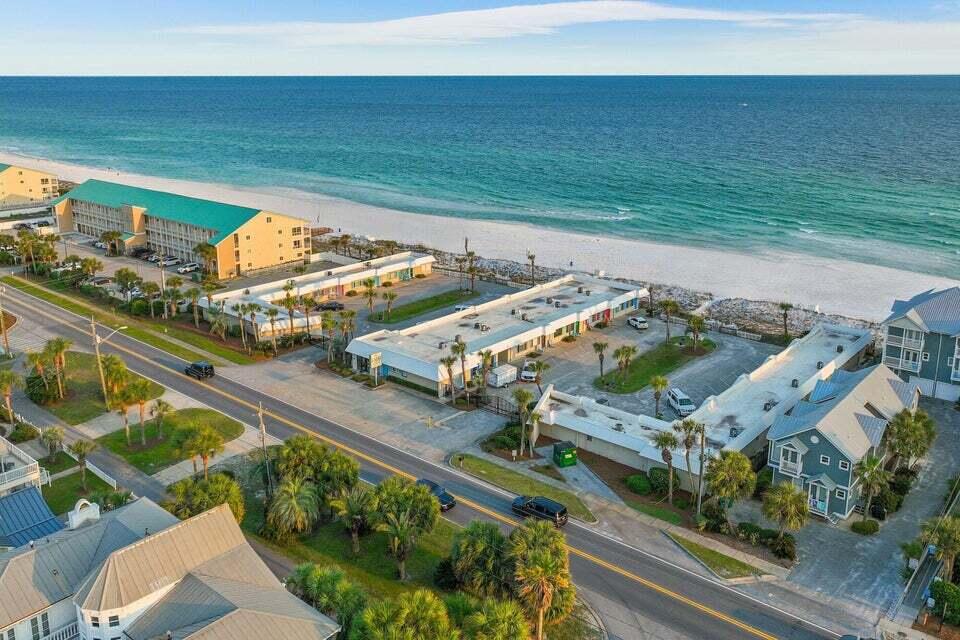 Quaint & Cozy Gulf Front condo ... just steps away from the white sandy beaches. Enjoy the newly remodeled  kitchen, while enjoying views of the Emerald green water. The property is situated on 300 feet of beach with private access, Enjoy Gulf views from two community decks, plus a barbecue area for outdoor dining. A perennial rental favorite generating $41k in  gross income in 2025 .... over 10% ROI based on list price.  A new roof was just installed, with a 10 year warranty, transferable to a new owner. PS; Owner has 6 units at Capri, all of which are for sale. Please call for more details.
