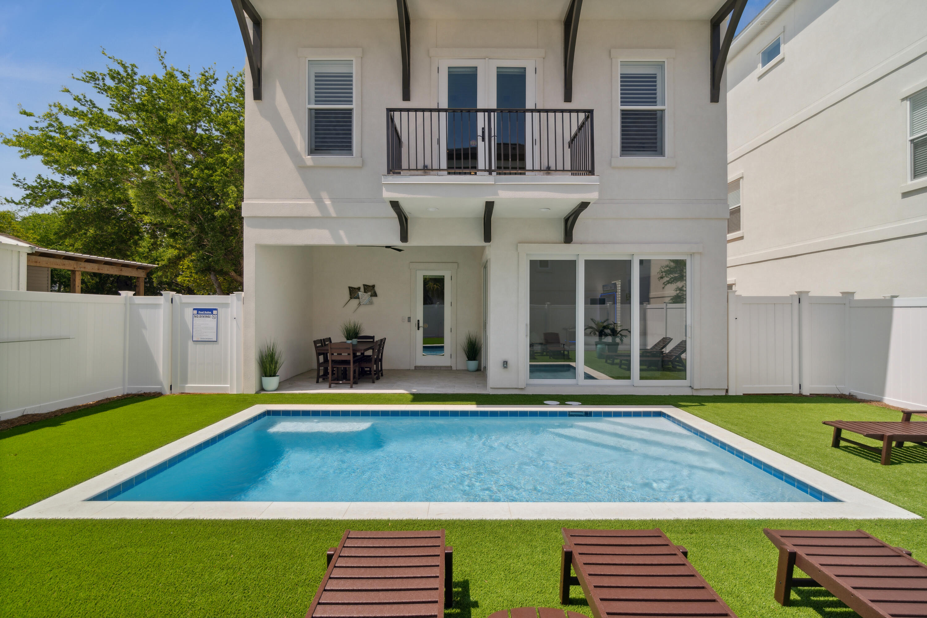 2023-built luxury beach home in the heart of Miramar Beach designed for large gatherings, memorable vacations, and strong vacation rental appeal. Offering 7 bedrooms, 6.5 bathrooms, and over 4,100 square feet, the home comfortably accommodates up to 21 guests with expansive indoor and outdoor gathering spaces, a private heated pool, game room, wet bar, and turnkey furnishings throughout. The three-story layout creates separation and privacy while maintaining an open, connected feel ideal for entertaining. Thoughtfully designed for both personal enjoyment and investment potential, this fully furnished coastal retreat is located just minutes from the beach, shopping, dining, and local attractions.