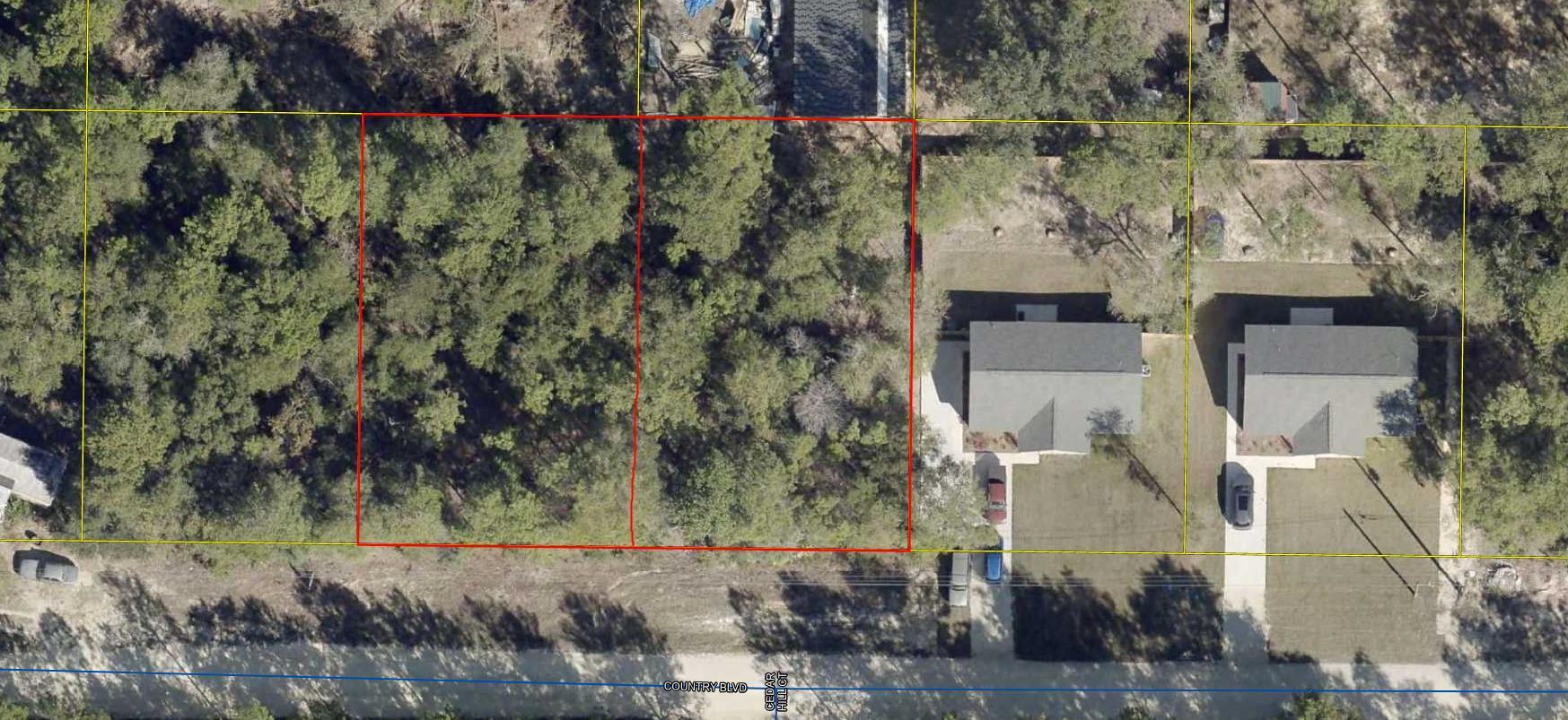 Wooded lot  80'x125' you can almost see Hwy 90 W in DeFuniak.  Located off Girl Scout Road.  
City water available, tap fee not paid.  Several new homes being built in this area.  Mobile homes allowed.  If you need more land, check out MLS 1001157.   They are side-by-side.