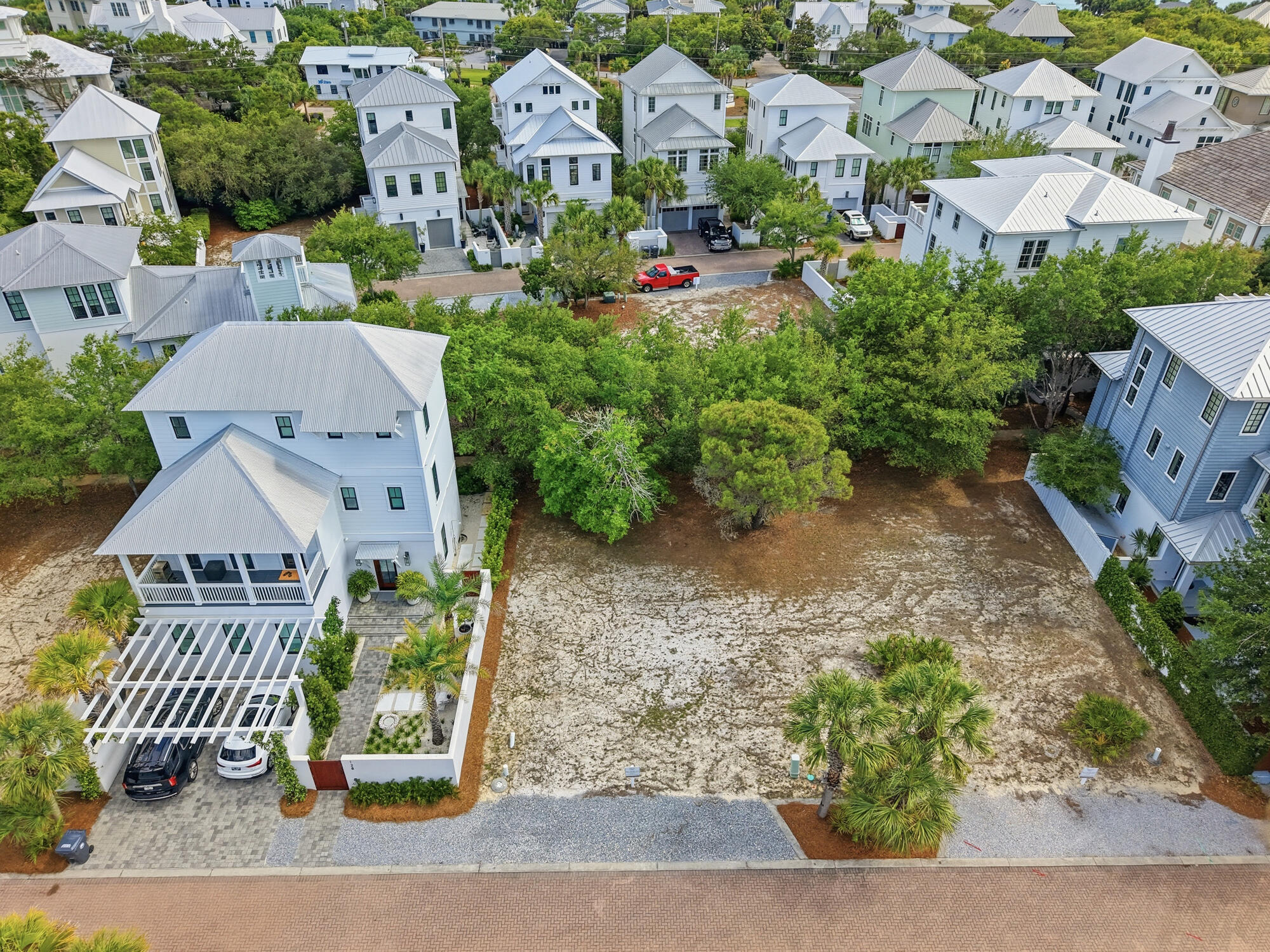 Set within the gated coastal community of Seanest Village, Lot 26 Sand Oaks Circle offers an exceptional opportunity to design and build a residence that reflects the relaxed elegance of life along Scenic Highway 30A. Defined by its intimate scale and thoughtfully curated surroundings, Seanest Village creates an atmosphere that feels both refined and welcoming, where the rhythm of coastal living unfolds with ease.

Owners enjoy dedicated beach access, placing the sugar-white sand and Gulf waters just moments away, while the community's carefully designed amenities elevate everyday living. A two-level resort-style pool, sunset tower, outdoor fireplace, and grilling area create inviting spaces for gathering, relaxing, and enjoying the coastal landscape from morning through evening.

The smaller scale of the community lends a more residential feel, offering a sense of comfort and connection that complements the surrounding natural beauty. Beyond the gates, the location places some of Santa Rosa Beach's most sought-after shopping, dining, and lifestyle destinations within convenient reach, balancing privacy with accessibility.

With its combination of beach access, thoughtfully designed amenities, and an enviable location along 30A, Lot 26 Sand Oaks Circle presents a rare opportunity to create a home that embraces both timeless coastal design and the effortless lifestyle that defines this celebrated stretch of the Gulf Coast.