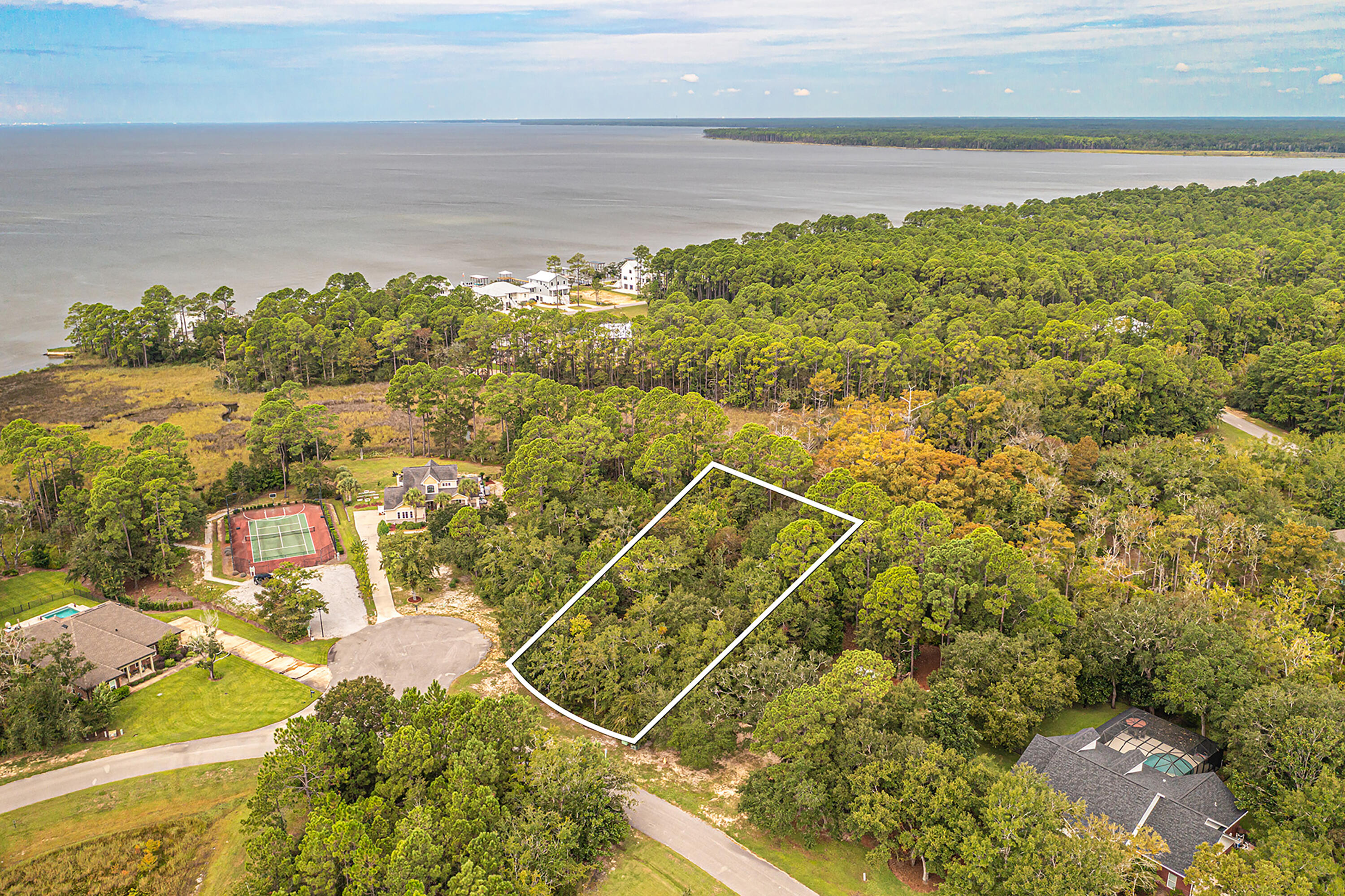 Build your dream home on this exceptional vacant lot in the secluded Bay Harbour community of Freeport, Florida! Lot 76 is also available. Tucked away on a quiet cul-de-sac, this property is truly ready to go--saving you time and expense with key due diligence already completed, including a boundary survey, wetland delineation study, and topographical survey. Enjoy a peaceful waterview setting and the natural beauty that surrounds you, all while being just a short stroll from community amenities like tennis courts and a scenic boardwalk leading to Choctawhatchee Bay. Whether you're planning a full-time residence or a serene coastal retreat, this homesite offers the perfect blend of privacy, convenience, and charm. Don't miss your chance to create your own slice of paradise--your sunset views are waiting!