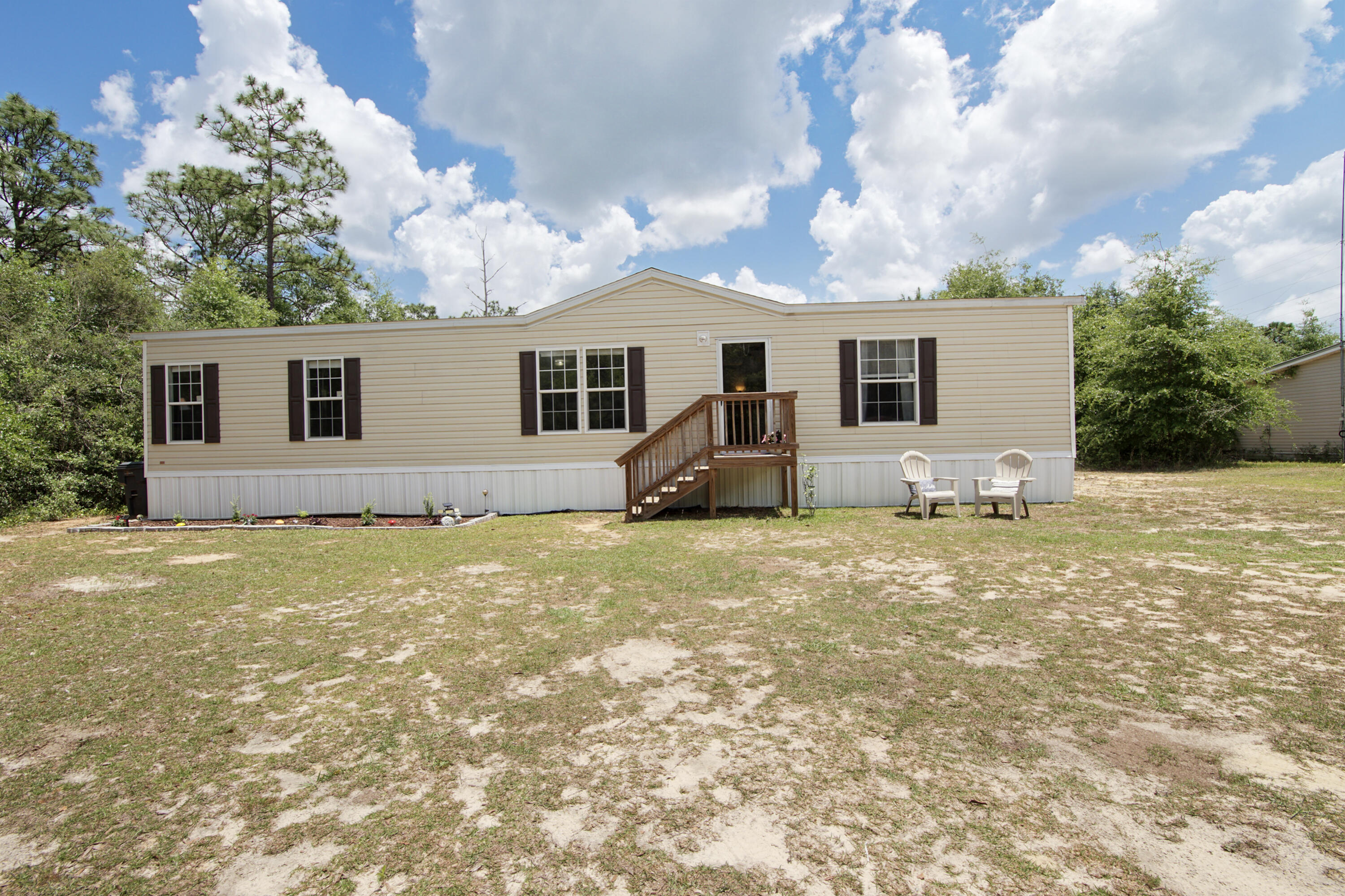 LAND AND NO HOA near Hwy 90 and 331!  
***Sellers offering $6500 Buyer Credit!!*** 
Enjoy the space and flexibility of country living in a 2021-built home just minutes from DeFuniak Springs and easy access south to Freeport and the beaches.
1-ACRE  HOMESITE-Grow your own vegetables, raise chickens, room for your RV or Boat- NO RESTRICTIONS- YOUR LAND, YOUR CHOICE!
Newer construction w a private setting OFFERING AFFORDABILITY AND PRIVACY while close to everything DFS has to offer: restaurants, shopping, winery, Great downtown area w weekly Farmer's Market and Endless events year-round! Live in the Country but a short, 40 Minute drive and you're on the Beautiful South Walton Beaches!!!