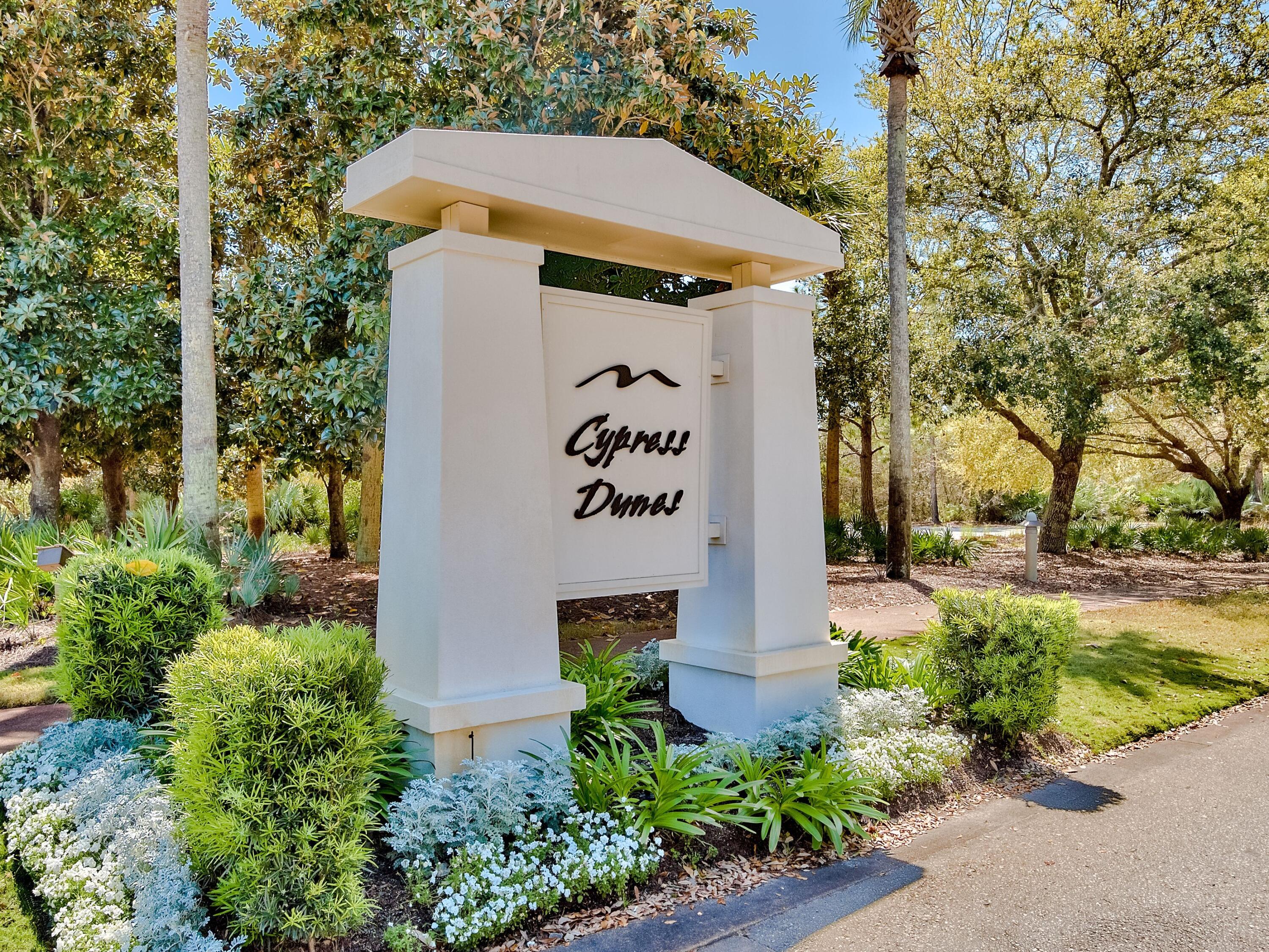 Cypress Dunes is a sanctuary of coastal elegance on the tranquil west end of Scenic Highway 30A in Santa Rosa Beach, Florida—where timeless architecture blends seamlessly with the untouched natural beauty of Topsail Hill Preserve State Park. This coveted gated community is defined by majestic cypress trees, serene walking paths, and breathtaking sunset views that create a peaceful retreat just minutes from sugar-white beaches, boutique shopping, and the vibrant dining that make 30A so beloved. Residents enjoy the rare opportunity to build a custom home that reflects their personal style while still honoring the community's refined coastal aesthetic, supported by thoughtful architectural guidelines and a selection of respected local builders. Cypress Dunes offers a premium location and exceptional craftsmanship, and lasting serenity in a setting protected from future overdevelopment. Its amenities are truly resort-caliberfeaturing two stunning pools including an infinity-edge pool overlooking the Gulf of America and rare Coastal Dune Lake, a jetted spa, a state-of-the-art fitness center, owners' clubhouse, outdoor fireplace, tennis & pickleball courts, a recreational lawn, and beautifully maintained boardwalks where local wildlife can often be spotted. Short term rentals are allowed with a six night minimum. A rustic elevated pathway connects Phase I to Phase II, leading to an additional resort-style pool with a cascading waterfall while offering sweeping views of the surrounding cypress landscape. Living in Cypress Dunes means embracing beauty, balance, and the easy rhythm of coastal living in one of Santa Rosa Beach's most desirable communities.

There are 21 floor plans that fit this lot that are listed under the document tab, along with the survey. The actual dimensions of the entire lot is 45 x 290 x 45 x 192. Lot goes half way into the cypress pond.