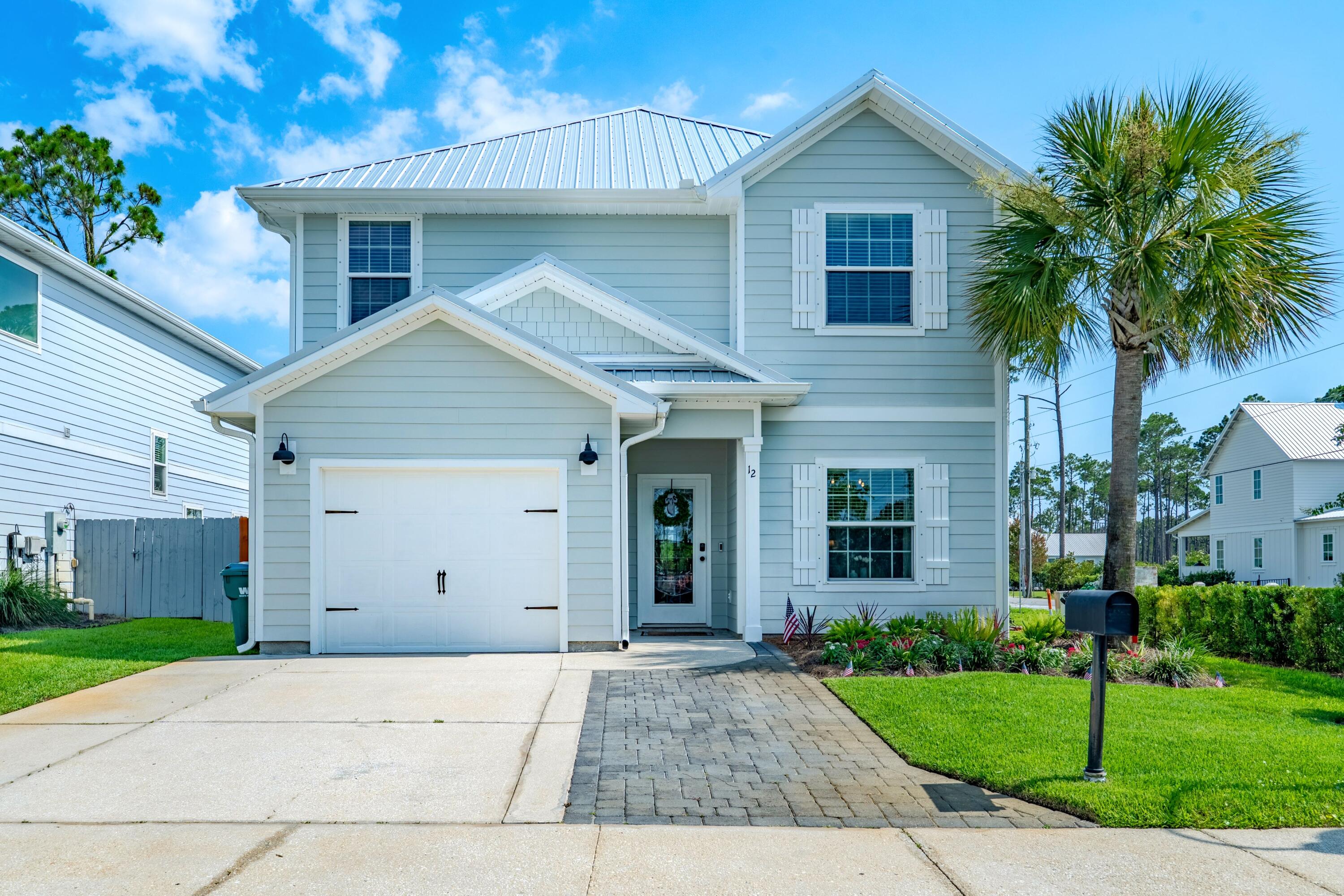 Coastal style and modern upgrades come together beautifully in this move in ready home. Offering 4 bedrooms, 3.5 bathrooms, 2,291 square feet of thoughtfully designed living space. This home features an open floor plan with a spacious upstairs bonus living area,providing flexibility for a second family room, playroom, media room,or home office. You'll also find the second ensuite upstairs!!

Extensively updated, the home showcases LVP flooring throughout, stunning custom tile work in the recently remodeled primary bathroom, powder bath, and laundry room. The newly added shiplap fireplace wall adds a beachy yet cozy vibe to the place as well. 

Built with both comfort and efficiency in mind, the home includes a gas tankless water heater, whole home dehumidifier system, and epoxy coated garage floors for added durability and easy maintenance. 

Step outside to your private backyard oasis featuring mature palm trees, a fully fenced in yard, and plenty of space for entertaining. Enjoy morning coffee in your screened in patio for added privacy and Florida charm.

Ideally located on the south side of hwy 98, and less than 2 miles to the beach, you'll be able to enjoy walks and bike rides to 30A, oyster lake, walking trails, Helen McCall park, many coffee shops, restaurants and more. 

This beautifully updated beach home truly has it all combining convenience, comfort, and coastal living at its finest!