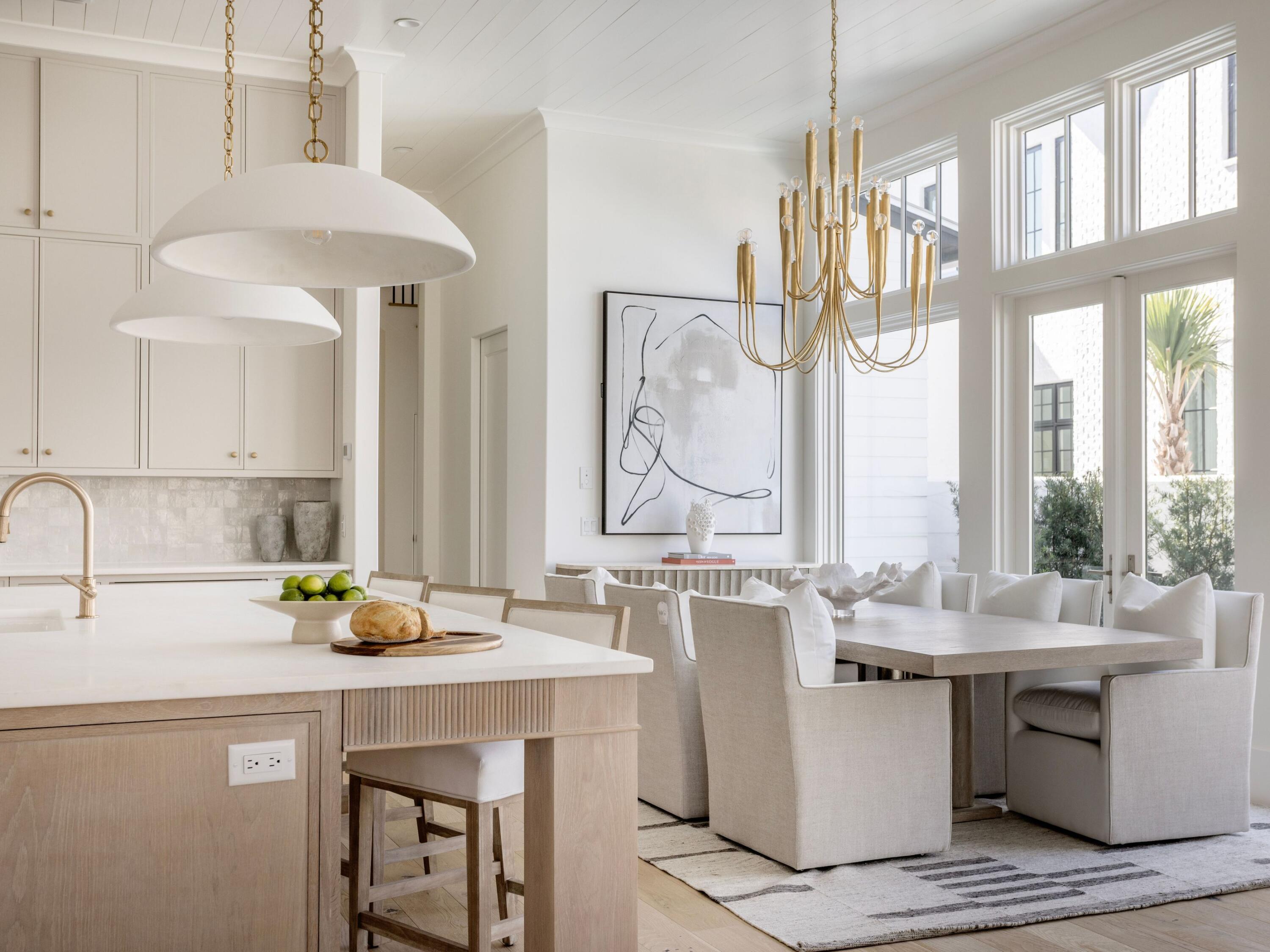 Set behind the gates of Churchill Oaks along the shores of Hogtown Bayou, this lakefront residence offers a thoughtful balance of architectural design, functionality, and coastal living. Designed by Savoie Architects and built by Grand Bay Construction, the home spans three levels and includes five bedrooms, five full baths, one half bath, a private carriage house, and elevator access to all floors. The main living space is designed for connection and flow, with a chef's kitchen featuring Sub-Zero and Wolf appliances, marble countertops, and shaker-style cabinetry that opens seamlessly into the dining and living areas. A built-in wet bar and expansive glass doors extend the living space to a private courtyard with a pool and summer kitchen, creating a natural setting for both everyday living and entertaining.

Interior finishes reflect a timeless approach with wire-brushed white oak flooring, Old Chicago brick accents, and custom lighting throughout. The primary suite has been enhanced with a spacious custom walk-in closet, offering both functionality and thoughtful design. Elevator access provides convenience across all levels.

Additional features include a third-floor bonus room with full bath, a climate-controlled carriage suite with its own HVAC system, dual laundry rooms, tankless water heaters, Cat6 wiring, recessed speakers, and multiple covered verandas designed for year-round use. The home is partially furnished, offering a curated starting point while allowing flexibility for personalization.

Churchill Oaks offers a gated waterfront lifestyle with access to a bayou front clubhouse, resort-style pools, fitness center, scenic walking paths, and a deep-water marina, all located just minutes from the beaches, dining, and shopping of 30A.