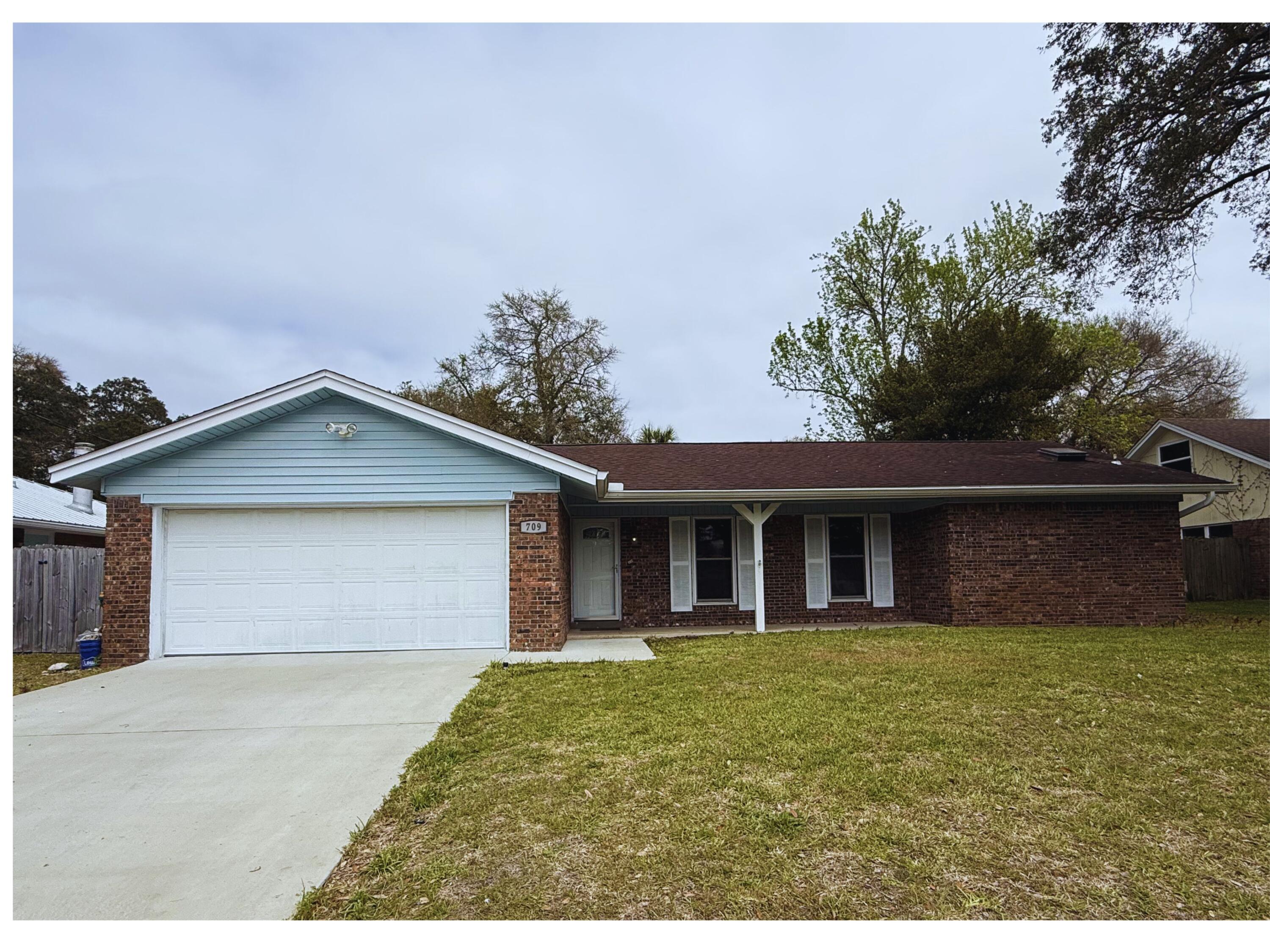 Move right into this updated brick home in a convenient Fort Walton Beach location. The bright, practical split floor plan places the master suite with its private en suite on one side of the house for added privacy, while two guest bedrooms share a full bath accessed from the family room. Recent updates to the kitchen and bathrooms provide a fresh, modern feel throughout the home. The kitchen rests between two living areas and is complemented by a large flexible space that can be used as a game room, home office, or second living room to suit your lifestyle. Outside, enjoy a fully fenced backyard perfect for pets and play, plus a two-car garage for secure parking and storage. Live minutes away from Hurlburt Field, Eglin AFB, shopping, hospital and the white sand beaches! Call to see today