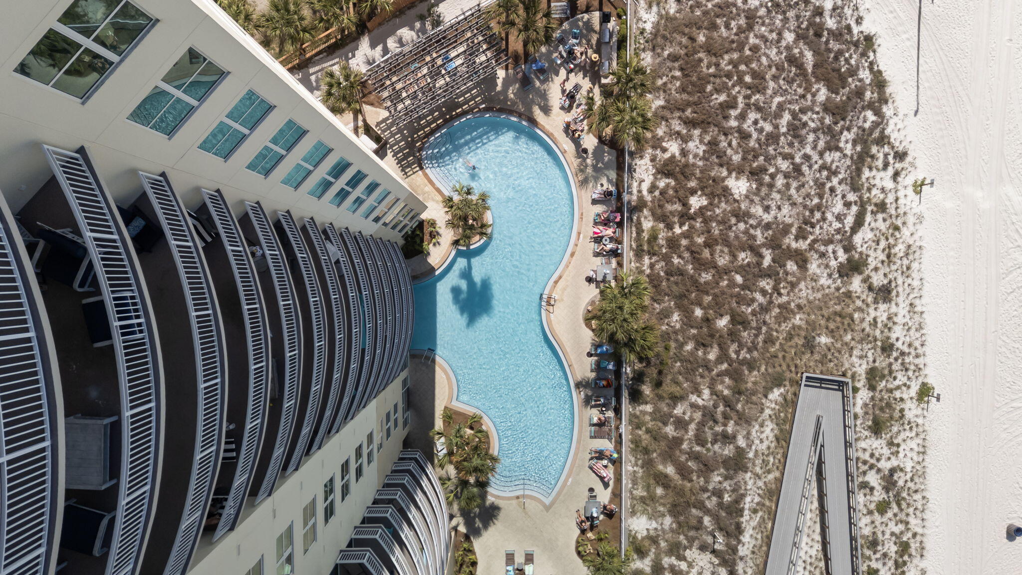 Welcome to Aqua Condo 1103 in Panama City Beach, Florida!! Two Large Beachfront Bedrooms with access to a comfortable, bow shaped balcony with extraordinary views make this one of the best floor plans anywhere on the beach! The open kitchen, dining, living space also features excellent views and balcony access while a 3rd bedroom with en-suite bath is also offered in this popular plan. These condos are true rental magnates and Aqua is one of the premier developments on Panama City Beach's west end just 1/4 mile to all of the activities at Pier Park. Aqua offers all of the amenities you need with two gulf front pools, hot tub, gulf front fitness center, covered parking, community room, tropical landscaping and more!