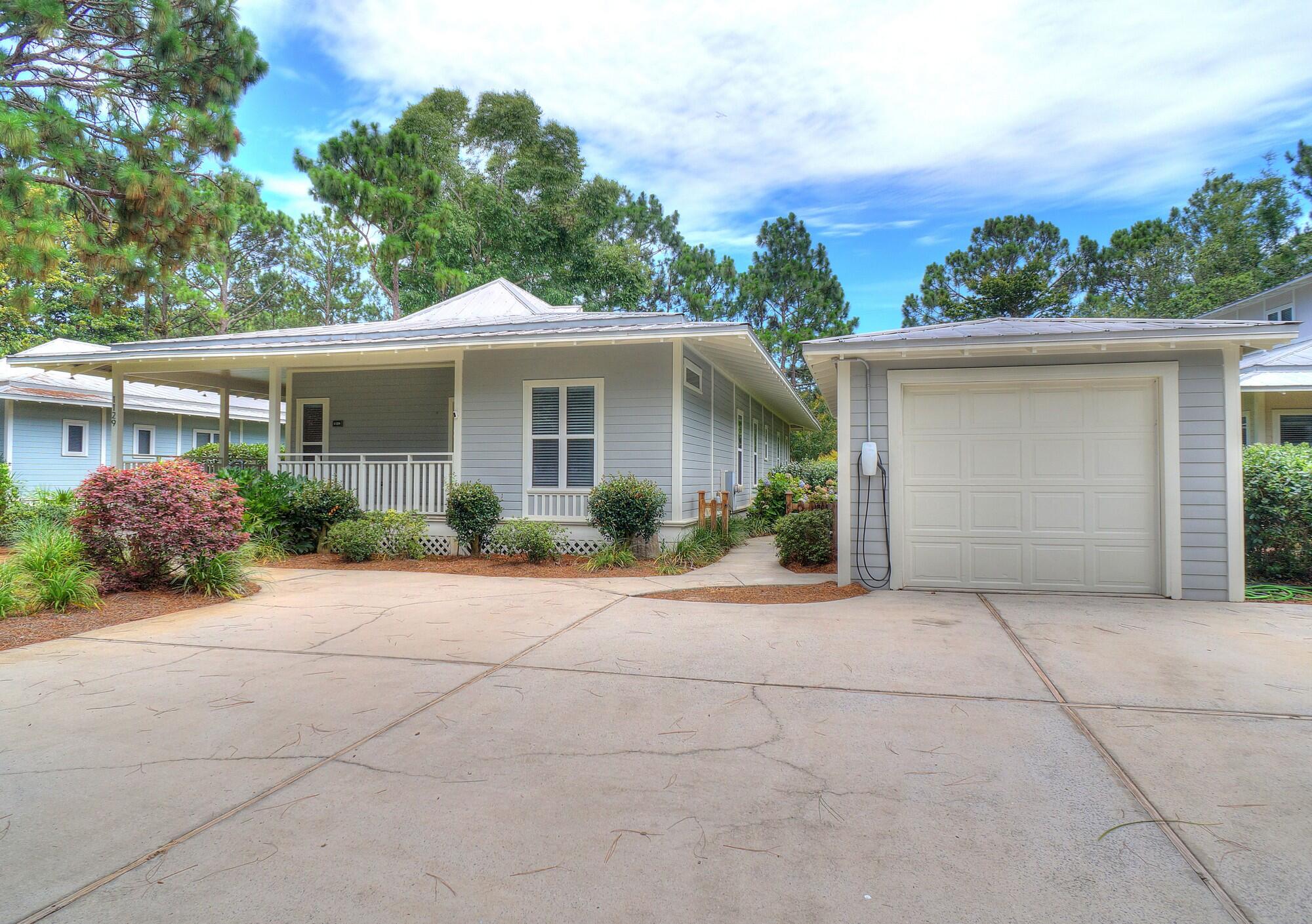 3-BEDROOMS + LARGE STUDIO!  Don't miss the opportunity to own this beautiful cottage home that sits on the largest lot in much sought-after Prestwick Place!  Enjoy the gorgeous views of the lake from the living room, rear bedroom, roomy screened back porch, or just step out to the newly-refurbished social dock and relax.  Entering from the large covered front porch, step into the freshly painted interior of the main house that offers an elegantly-appointed kitchen with large granite countertops, a spacious living/dining area enhanced with a gas fireplace, and three large bedrooms, each with its adjoining full bath. The front and rear bedrooms also feature private entrances. An additional large bonus room with full bath is located in the freshly-painted interior of the detached studio building, which also provides a handy storage room with an exterior entrance.  Your new cottage has ceiling fans throughout, including 2 brand new fans on the back screened porch. Fiber Internet was just installed in each house in the neighborhood. Prestwick Place is a prestigious Lakeside community located within the world-famous Sandestin Golf and Beach resort.  Sandestin Golf and Beach Resort is a premier 2,400-acre, self-contained destination resort located in Miramar Beach, Florida, just eight miles east of Destin. Spanning from the sugar-white beaches of the Gulf of Mexico to the shores of Choctawhatchee Bay, this sprawling property operates like a private, gated coastal town. Sandestin offers four award-winning golf courses, a 113-slip full-service marina, sunset dinner cruises,  and a world-class Tennis Center featuring 15 hard and HydroGrid clay courts alongside dedicated pickleball configurations. There's an abundance of retail & nightlife, with more than 20 restaurants, open-air bars, specialty boutiques, a day spa, and family adventures (like zip-lining) inside Baytowne Wharf.