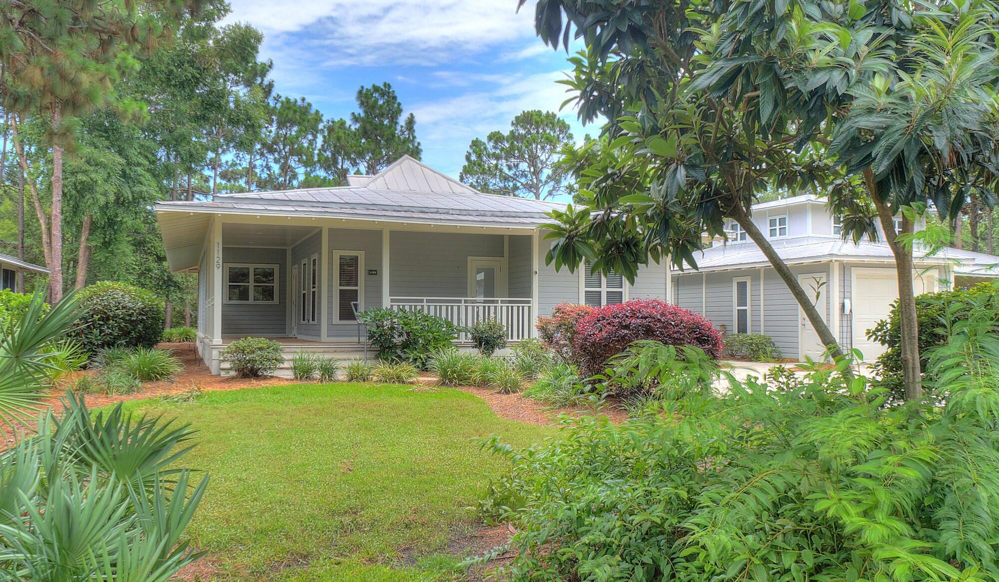 3-BEDROOMS + LARGE STUDIO!  Don't miss the opportunity to own this beautiful cottage home that sits on the largest lot in much sought-after Prestwick Place!  Enjoy the gorgeous views of the lake from the living room, rear bedroom, roomy screened back porch, or just step out to the newly-refurbished social dock and relax.  Entering from the large covered front porch, step into the freshly painted interior of the main house that offers an elegantly-appointed kitchen with large granite countertops, a spacious living/dining area enhanced with a gas fireplace, and three large bedrooms, each with its adjoining full bath. The front and rear bedrooms also feature private entrances. An additional large bonus room with full bath is located in the freshly-painted interior of the detached studio building, which also provides a handy storage room with an exterior entrance.  Your new cottage has ceiling fans throughout, including 2 brand new fans on the back screened porch. Fiber Internet was just installed in each house in the neighborhood. Prestwick Place is a prestigious Lakeside community located within the world-famous Sandestin Golf and Beach resort.  Sandestin Golf and Beach Resort is a premier 2,400-acre, self-contained destination resort located in Miramar Beach, Florida, just eight miles east of Destin. Spanning from the sugar-white beaches of the Gulf of Mexico to the shores of Choctawhatchee Bay, this sprawling property operates like a private, gated coastal town. Sandestin offers four award-winning golf courses, a 113-slip full-service marina, sunset dinner cruises,  and a world-class Tennis Center featuring 15 hard and HydroGrid clay courts alongside dedicated pickleball configurations. There's an abundance of retail & nightlife, with more than 20 restaurants, open-air bars, specialty boutiques, a day spa, and family adventures (like zip-lining) inside Baytowne Wharf.