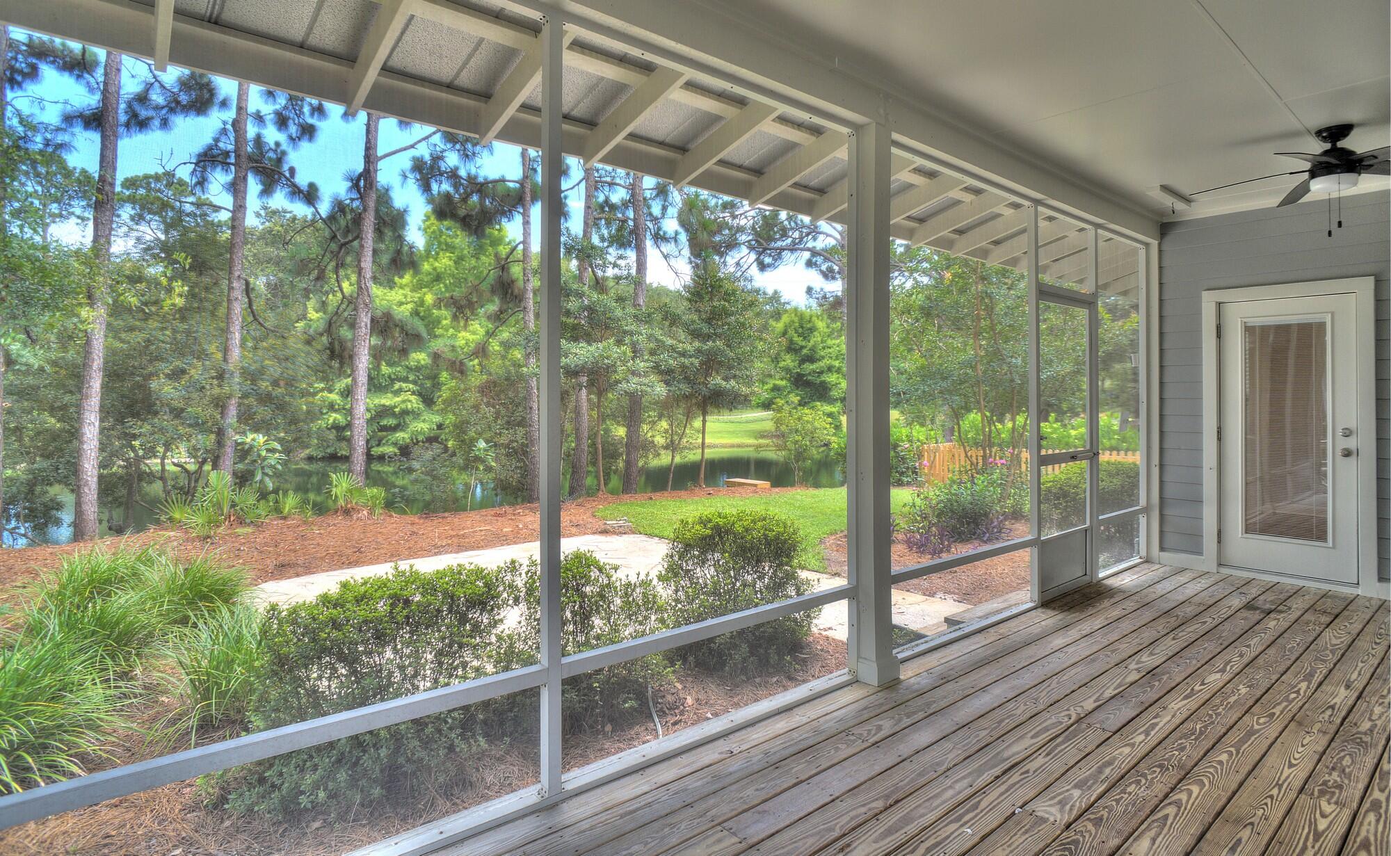 3-BEDROOMS + LARGE STUDIO!  Don't miss the opportunity to own this beautiful cottage home that sits on the largest lot in much sought-after Prestwick Place!  Enjoy the gorgeous views of the lake from the living room, rear bedroom, roomy screened back porch, or just step out to the newly-refurbished social dock and relax.  Entering from the large covered front porch, step into the freshly painted interior of the main house that offers an elegantly-appointed kitchen with large granite countertops, a spacious living/dining area enhanced with a gas fireplace, and three large bedrooms, each with its adjoining full bath. The front and rear bedrooms also feature private entrances. An additional large bonus room with full bath is located in the freshly-painted interior of the detached studio building, which also provides a handy storage room with an exterior entrance.  Your new cottage has ceiling fans throughout, including 2 brand new fans on the back screened porch. Fiber Internet was just installed in each house in the neighborhood. Prestwick Place is a prestigious Lakeside community located within the world-famous Sandestin Golf and Beach resort.  Sandestin Golf and Beach Resort is a premier 2,400-acre, self-contained destination resort located in Miramar Beach, Florida, just eight miles east of Destin. Spanning from the sugar-white beaches of the Gulf of Mexico to the shores of Choctawhatchee Bay, this sprawling property operates like a private, gated coastal town. Sandestin offers four award-winning golf courses, a 113-slip full-service marina, sunset dinner cruises,  and a world-class Tennis Center featuring 15 hard and HydroGrid clay courts alongside dedicated pickleball configurations. There's an abundance of retail & nightlife, with more than 20 restaurants, open-air bars, specialty boutiques, a day spa, and family adventures (like zip-lining) inside Baytowne Wharf.