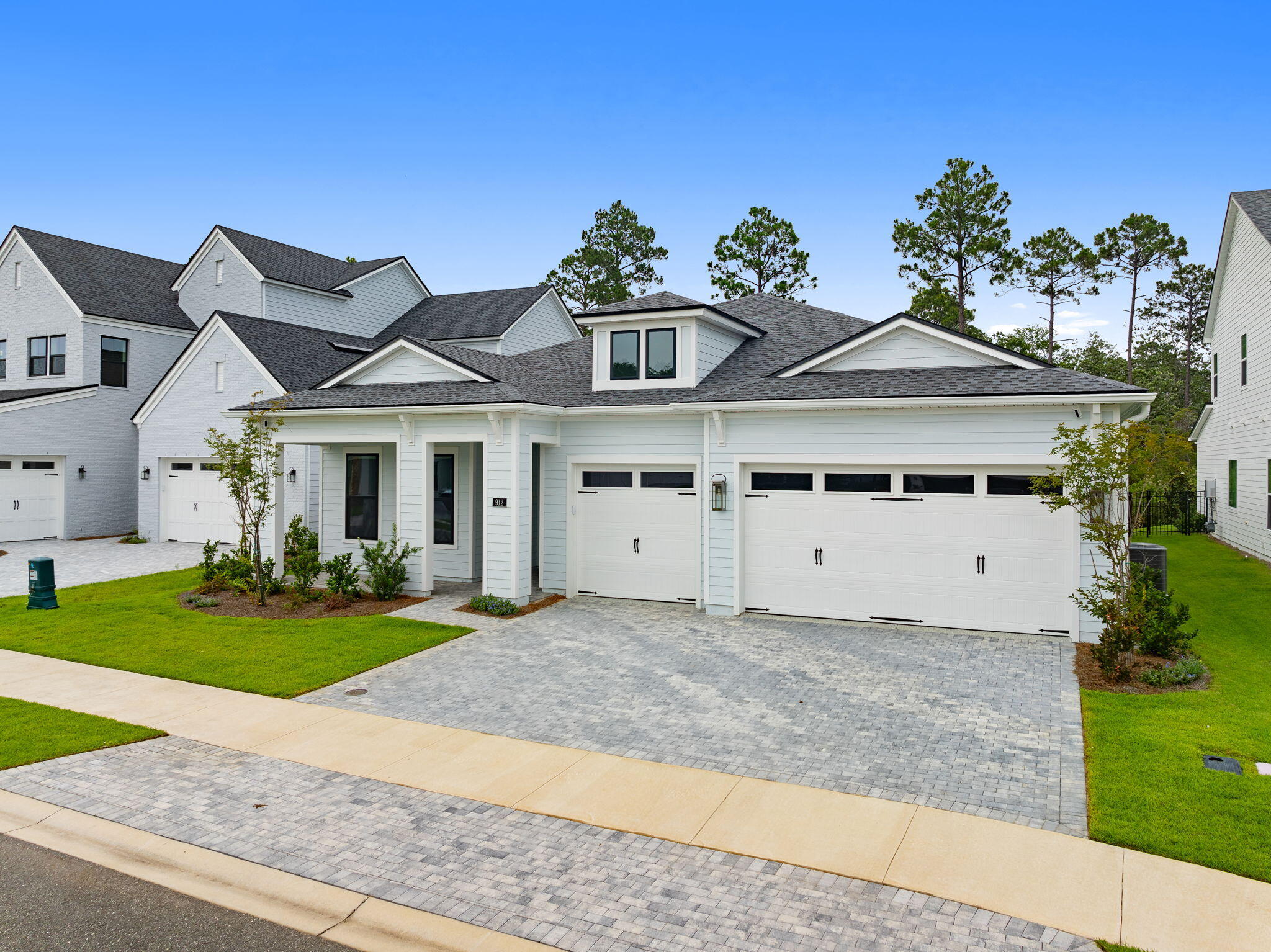 Welcome to Breakwater, one of Panama City Beach's premier gated communities, where resort-style amenities, modern design, and everyday convenience come together. This beautifully maintained 4-bedroom, 3.5-bath home features soaring ceilings, an open-concept layout, a spacious 3-car garage, and a backyard with plenty of room to create your own private oasis, including space for a future pool. Situated on a desirable corner homesite near a quiet cul-de-sac, this move-in-ready home offers all the benefits of new construction without the wait. Filled with natural light, the spacious kitchen and living area create the perfect place for entertaining, gathering with family, and enjoying everyday life. The primary suite features a spa-inspired bath complete with an oversized soaking tub, creating the perfect place to unwind. What truly sets this Panama City Beach home apart is the lifestyle. Breakwater residents enjoy resort-style amenities including a community pool, pickleball courts, tennis courts, fitness center, clubhouse, playground, and a gated entrance--all designed to make everyday living feel a little more like a getaway. Conveniently located just minutes from shopping, dining, Northwest Florida Beaches International Airport, Pier Park, and the beautiful white-sand beaches of the Emerald Coast, this home offers the perfect combination of luxury, convenience, and coastal living. Where everyday living feels like a getaway!!