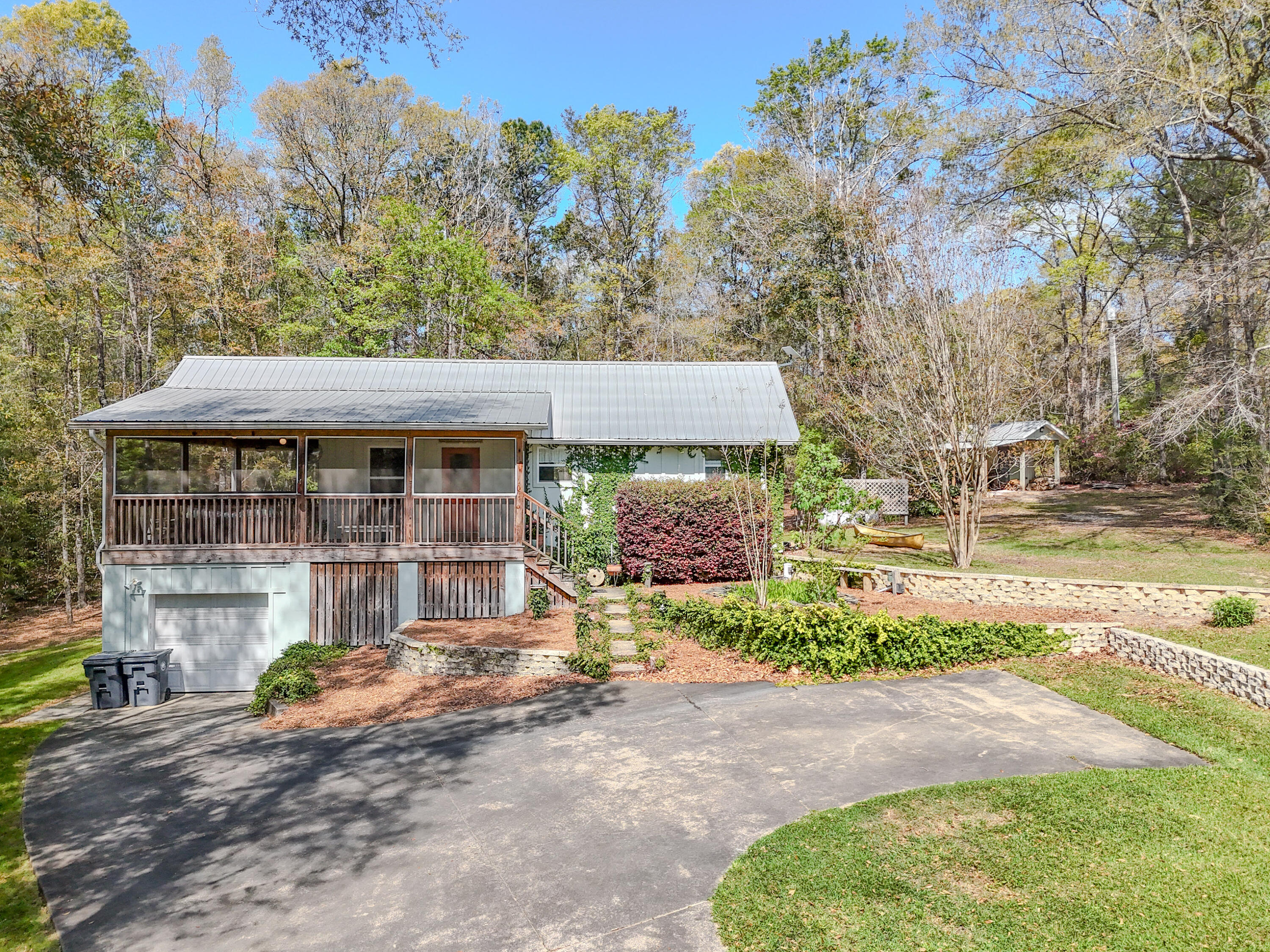 Nestled at 211 Lester Price Rd in Ponce de Leon, this 1,152 sq ft home (built 2004) on 1.73 Acres offers peaceful rural living just minutes from Hwy 81 and Interstate 10. Step inside to find bright, inviting open-concept living spaces with soaring vaulted ceilings and beautiful pine hardwood floors that flow throughout. The well-designed kitchen is a standout, featuring crisp white shaker cabinets, a convenient tiled island, stainless steel sink, and generous natural light pouring in from the oversized window--ideal for everyday meals or entertaining.
The thoughtfully laid-out interior includes a full bathroom with classic pedestal sink, a dedicated laundry room complete with washer/dryer hookups and ample storage, a flexible bedroom, and additional bonus space perfect for a  home office, hobby room, or creative retreat. A huge screened porch with ceiling fan provides the perfect spot to unwind while enjoying views of the lush yard and the charming garden pond with its soothing fountain--wonderful for morning coffee, evening relaxation, or simply soaking in the serene surroundings.
Generac whole-house propane generator ensures reliable power and peace of mind during storms or outages. Outside, you'll appreciate the practical pump house and garden shed offering storage and a workbench, along with a workshop area and UTV-ready space. The full 1.73 wooded acres create endless opportunities for gardening, wildlife observation, outdoor recreation, or future expansion while maintaining wonderful privacy.
Recent updates throughout make this home truly move-in ready. A rare find for nature lovers and those seeking a tranquil country lifestyle with modern comforts. Call today to schedule your private showing and experience the charm for yourself!
