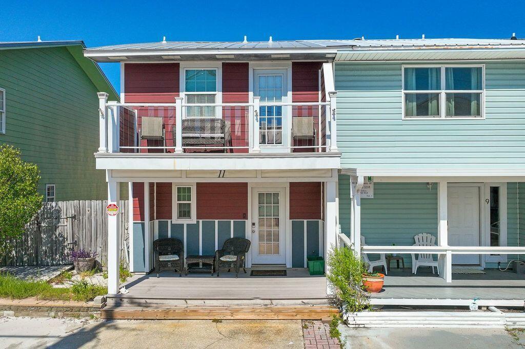 This beautifully updated townhouse located on desirable Holiday Isle, features scenic views of both the harbor and the Gulf. Offering the perfect location for both the fishing enthusiast and the family beach vacation, this property provides excellent potential as an investment property, vacation getaway, or full-time residence. Tucked away on a private street, this home was thoughtfully remodeled in 2019 to provide modern comfort and style.

The main level features an open-concept layout with updated appliances, custom countertops, and low-maintenance LVP flooring--perfect for everyday living and entertaining. Upstairs, you'll find two spacious bedrooms, each with its own private en-suite bathroom. The primary suite includes a cedar-lined walk-in closet, double vanity, and a walk-in shower Additional highlights include cedar ceilings throughout the upper level, a large back deck ideal for gatherings, and deeded beach access just a short stroll away. The property has new washer and dryer, new hot water heater and a new HVAC system. Low HOA fees add to the appeal, while the home's prime location offers convenient access to popular harbor-side dining, shopping, and entertainment.
A rare opportunity to own in one of the area's most sought-after coastal communities.