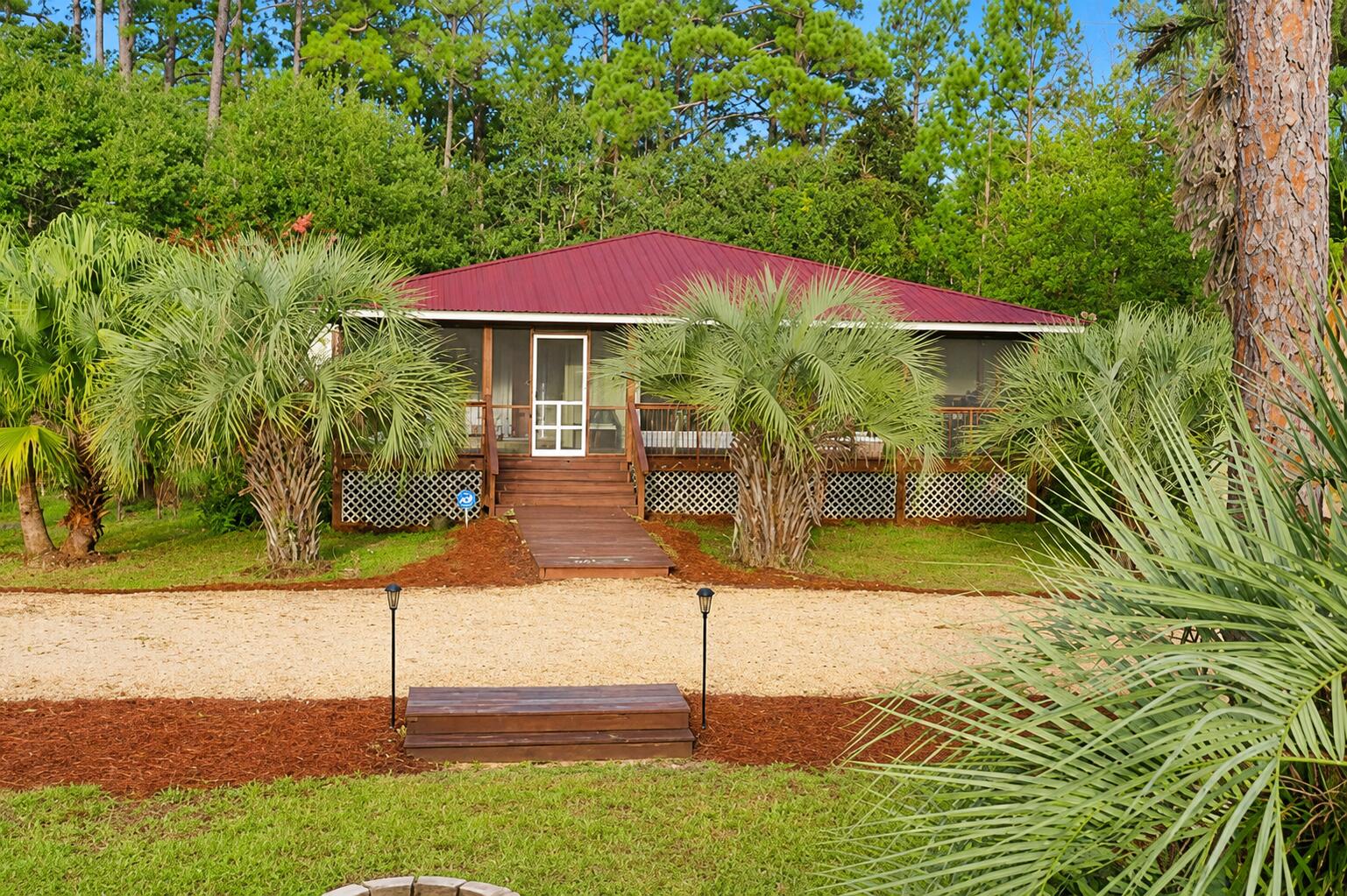 One-of-a-kind Bahama-style home available for rent in beautiful Santa Rosa Beach!

This unique 3 bedroom, 3 full bathroom home offers approximately 1,650 square feet of living space on a spacious half-acre lot with no HOA restrictions. The home features custom details and beautiful hand-painted murals throughout, giving it charm and character you won't find anywhere else.

Property features include:

 Large living room
 Separate oversized sunroom
 New A/C unit
 Brand-new washer and dryer
 Refrigerator only 3 years old
 No carpet laminate flooring and tile throughout
 Large horseshoe driveway with plenty of parking
 Lawn service included at no additional charge

Conveniently located in Santa Rosa Beach close to shopping, dining, beaches, and schools.

References and background check required.

For more information or to schedule a showing

Owner will maintain the lawn service free trash pick up
No smoking inside the home