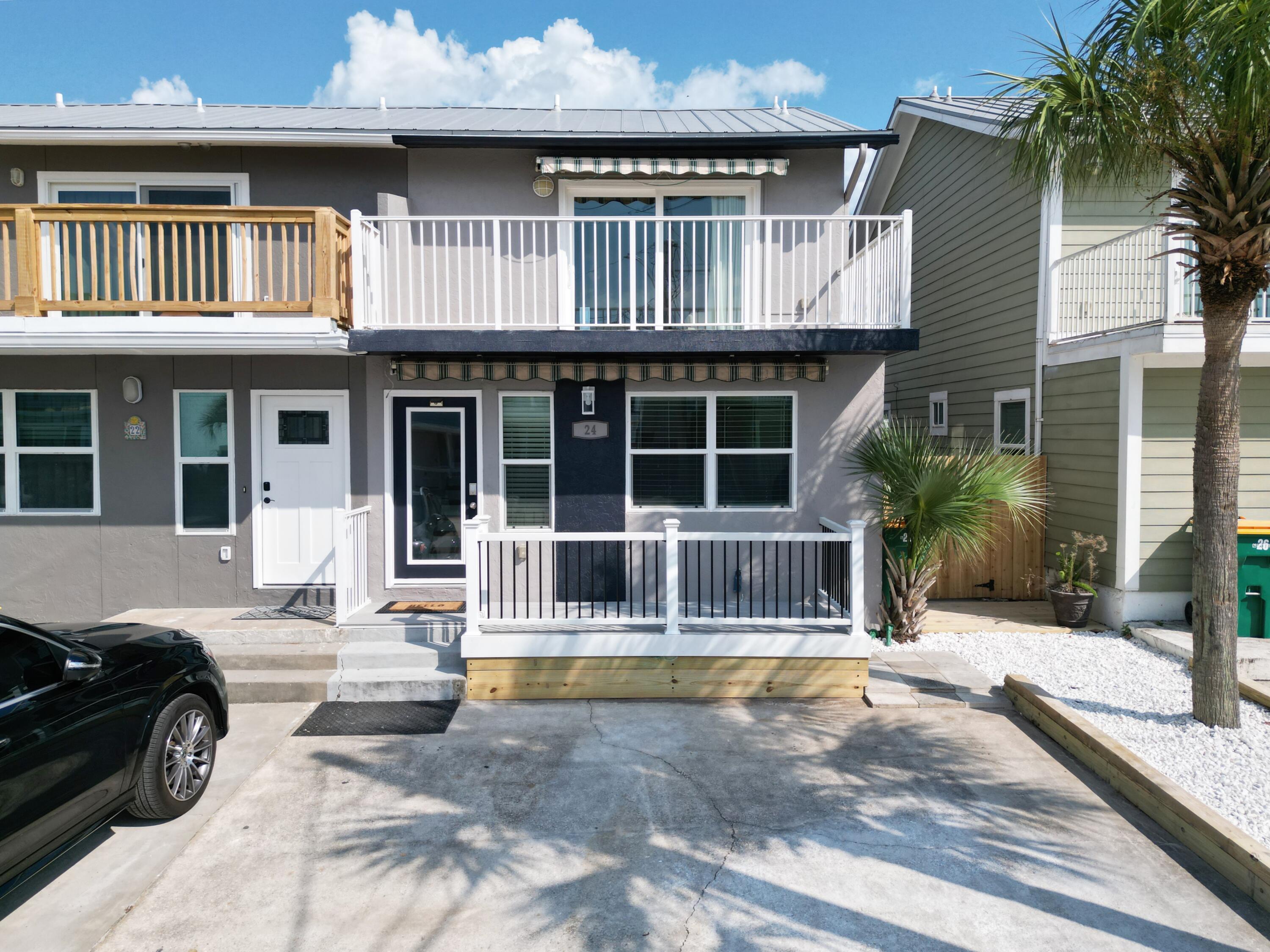 2026 Gross Rentals -$25,600 (145Nights) CAO 29MAY
Newly renovated! New paint inside and out. Beautiful modern 2 bedroom 2.5 bath end unit townhome with easy beach access. Water view of the inlet and harbor. Perfect for a vacation rental, second home, or forever home. Located on a private street and LOW annual HOA fee of $355/yr to the master HOA (Holiday Isle Improvement Association). Thoughtfully designed bathrooms, LVP flooring throughout, 2 upper balconies, front porch and back patio area that offers plenty of space to spread out. NEW HVAC system, NEW water heater, spiral staircase from upper back balcony to lower patio. Impact rated windows/doors. Metal Roof. Solid custom kitchen cabinets with quartz countertops and large island. Zeroscape for easy exterior maintenance.