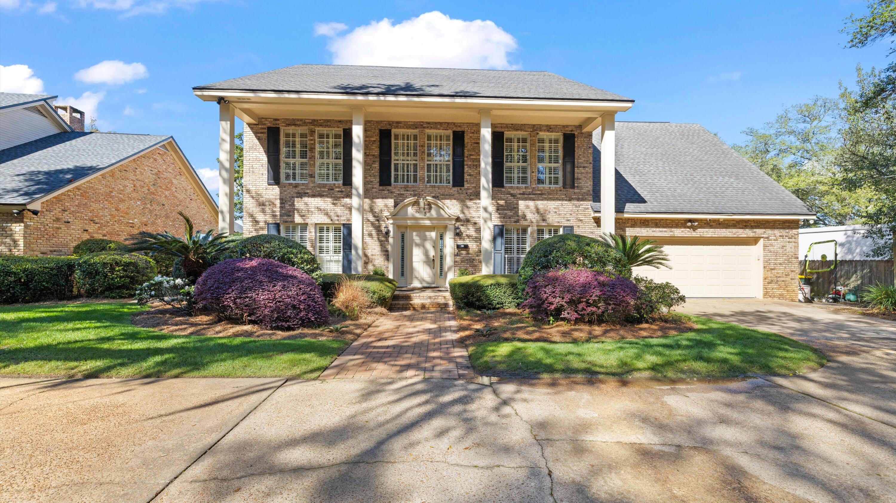 Welcome to 217 Yacht Club Drive, a stunning waterfront home in Fort Walton Beach offering timeless charm and beautiful water views along Florida's Emerald Coast. This stately two-story brick home features a classic columned façade, manicured landscaping, and inviting curb appeal. This location was originally selected as the personal 'fish camp' for the Hughes family, who owned much of the surrounding land at the time--adding a unique piece of local history to this special location. Enjoy a backyard oasis with a sparkling pool overlooking the water, perfect for relaxing or entertaining. Just minutes from shopping, dining, and the white-sand beaches, or a short boat ride to the fishing and entertainment of Destin.