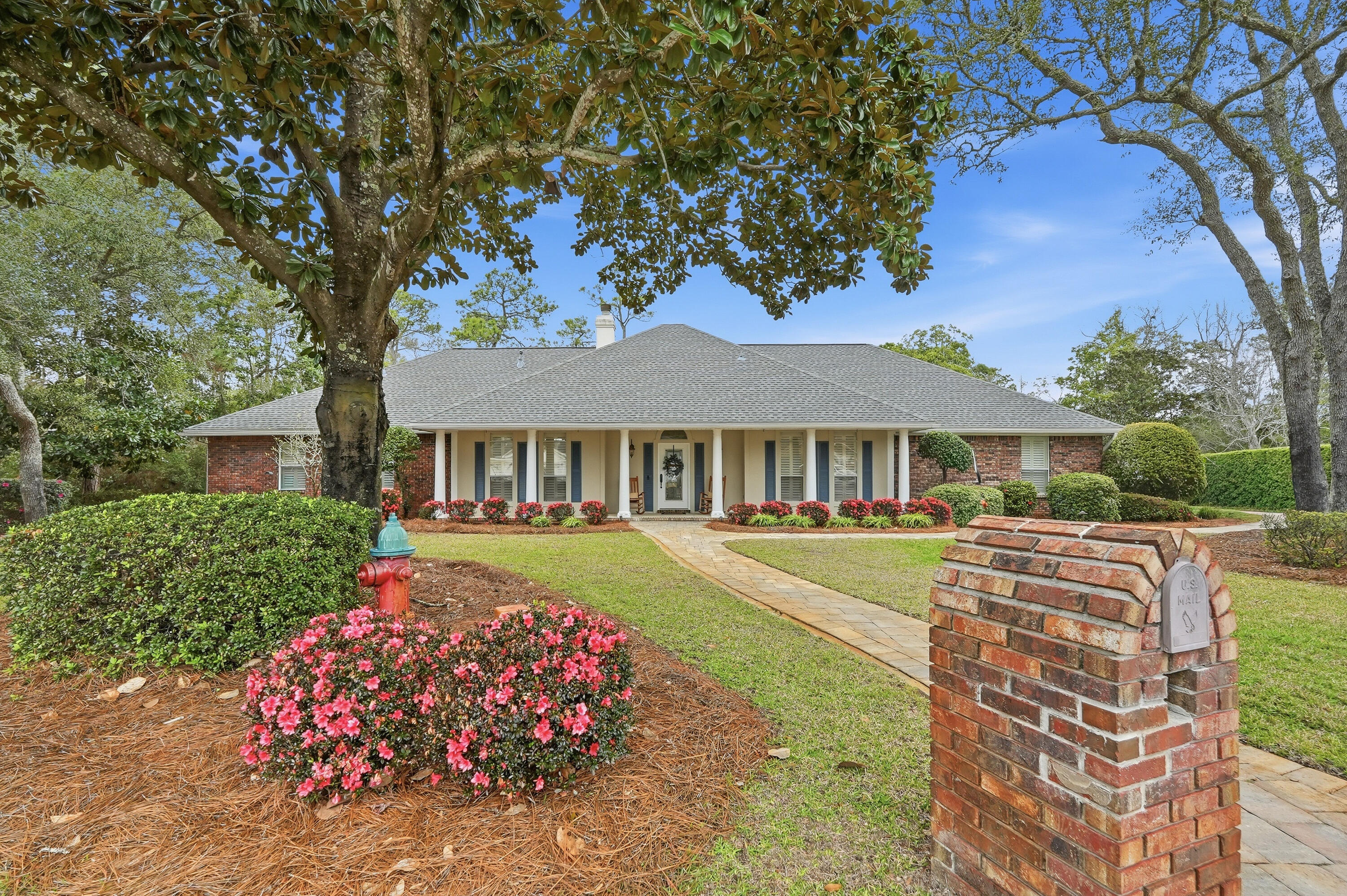 A WONDERFUL OPPORTUNITY FOR BUYERS- An executive ranch, thoughtfully designed for those who appreciate quality, privacy, and the luxury of space. Nestled on a quiet cul-de-sac within the gated Southwind community, this waterfront property offers a rare opportunity to enjoy peaceful surroundings, expansive outdoor living, and the potential to further enhance your water views over time. With 4 bedrooms and 3.5 baths, this versatile layout is ideal for multi-generational living or hosting guests. The home features two private primary suites, each beautifully appointed with an ensuite bath, walk-in shower, garden tub, and spacious walk-in closets--creating comfortable, private retreats within a home built for connection.  From the moment you step inside, you're welcomed by vaulted ceilings and a stunning stone gas fireplace, creating a warm and inviting atmosphere. The open-concept design seamlessly connects the eat-in kitchen, formal dining area, and spacious Florida room--perfect for entertaining, holidays, and everyday living. A light-filled sunroom offers a peaceful escape for morning coffee or unwinding with a good book while taking in the natural surroundings.  Step outside to your large private outdoor oasis, where 100 feet of waterfront awaits. While the natural vegetation currently offers added privacy, selective clearing could easily open up beautiful water views. Enjoy the space to relax, entertain, and take in the peaceful surroundings of your serene, waterfront setting.  More than just a home, this is a place to gather, unwind, and create lasting memories. Schedule your private showing today.