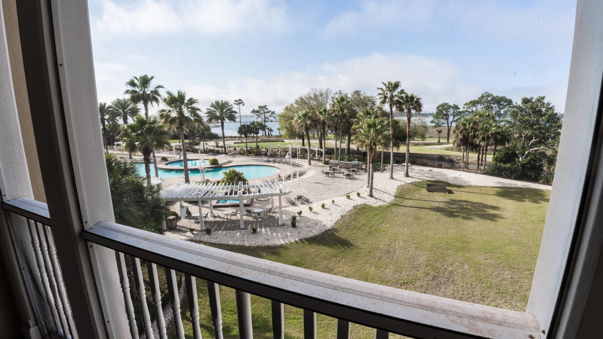 ~~Price Correction~~This low rise 2 BDRM condo is Bay front you have an amazing view of the resort pool but, far enough away from the pool noise. If relaxing is on your agenda there is a full-service spa on the first floor. Golfing, fishing, sunning, and or biking all great in this area. The complex allows short term rentals, and many make this their full-time residence.
