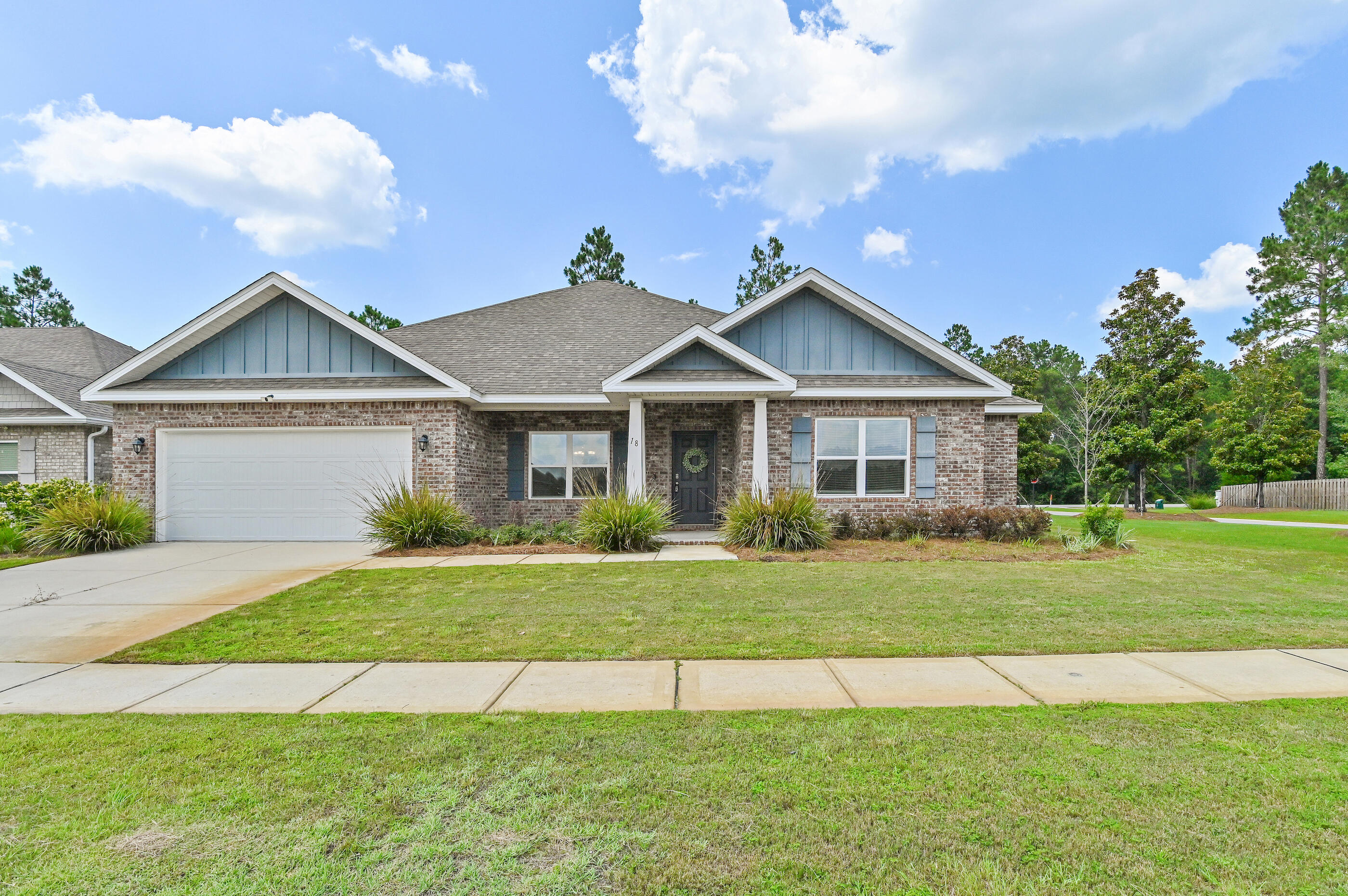 Welcome to 18 W Sky Way in the highly sought-after Hammock Bay community in Freeport, FL. Built in 2023, this beautifully designed brick home features the popular Rosemary floor plan with 4 bed, 3 full baths a dedicated flex room ideal for a home office, gym, or playroom, and nearly 2900 square feet of thoughtfully designed living space. The open-concept layout is filled with natural light and offers luxury EVP flooring, crown molding, a split-bedroom design, and a spacious owner's suite with a sitting area, tray ceiling, oversized walk-in closet, and private bath. The chef-inspired kitchen features quartz countertops, a large center island, walk-in pantry, and gas range, creating the perfect space for everyday living and entertaining. The home is located in desirable Flood Zone X.

Life in Hammock Bay offers an exceptional resort-style lifestyle with three pools, a fitness center, clubhouse, pickleball and tennis courts, sports courts, playgrounds, dog parks, miles of walking and biking trails, a neighborhood general store, food truck court, and year-round community events. Conveniently located in Freeport, you're just minutes from Choctawhatchee Bay, Blue Mountain Beach, Scenic Highway 30A, the Gulf of America, state parks, boating, fishing, shopping, dining, and some of Florida's most beautiful white-sand beaches. If you're searching for a move-in-ready home in Freeport with modern finishes, an open floor plan, gas stove than this is your perfect place to call home.