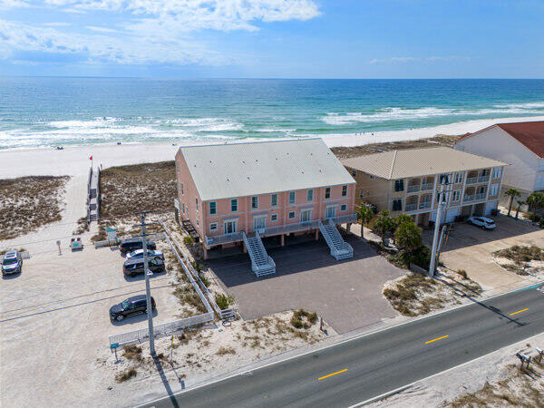 CASH FLOWING OPPORTUNITY ON THE BEACH! Fully furnished! *ask for cash flow sheet - no HOA*

RARE GULF-FRONT TOWNHOME 
Directly on the sugar-white sands of Navarre Beach, this fully furnished Gulf-front townhome offers the rare combination of beachfront ownership, no HOA, and immediate turnkey enjoyment.

The spacious three-story layout comfortably sleeps up to 10 guests and is designed to maximize Gulf views throughout the home. Features include an open-concept living area, coastal finishes, direct beach access, and a whole-home dehumidification system for added comfort and protection in the coastal environment.

For buyers seeking income potential, the property is professionally managed and currently booked through mid-October. The existing rental program and management team can be continued for a seamless transition, or future bookings can be adjusted to accommodate personal use.
Whether you're looking for a private beach retreat, second home, or income-producing property, this home offers exceptional flexibility in one of Florida's most desirable beach communities. Offered fully furnished and ready to enjoy from day one.
Seller just paid for an appraisal and it appraised for over 1.2! BRING AN OFFER THIS IS A GREAT INVESTMENT OPTION OR SECOND HOME! NO HOA AND ON THE BEACH! 

*Seller willing to contribute to closing costs or credits!*