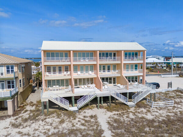 MOTIVATED SELLER! CASH FLOWING OPPORTUNITY ON THE BEACH! Fully furnished! *ask for cash flow sheet - no HOA*
BRING AN OFFER! COME SEE IN PERSON! This turnkey, income-producing waterfront townhome sits directly on the emerald waters of the highly desirable Navarre Beach and offers projected annual rental income of $150,000!!! NO HOA FEES! WOW!!
Sold fully furnished and rental-ready, the three-story layout comfortably sleeps up to 10 guests, making it ideal for short-term vacation rentals or a second home with strong income potential. The first floor features an open-concept living, dining, and kitchen area with tile flooring throughout and sweeping Gulf views. MOTIVATED SELLER! BRING AN OFFER! 

Seller just paid for an appraisal and it appraised for over 1.2! BRING AN OFFER THIS IS A GREAT INVESTMENT OPTION OR SECOND HOME! NO HOA AND ON THE BEACH! 

*Seller willing to contribute to closing costs or credits!*  The updated kitchen includes freshly painted gray cabinetry, granite countertops, stainless steel appliances, and an ice machine, while the spacious partially covered balcony provides ample outdoor seating--an attractive feature for renters seeking a true beachfront experience.

The second floor offers three well-appointed bedrooms, two of which have private covered balconies overlooking the Gulf, along with a conveniently located full bath and laundry closet. The third level enhances revenue appeal with a private primary suite featuring its own covered balcony with Gulf views, a jetted tub, separate walk-in shower, double vanities, walk-in closet, and private water closet. An additional large bedroom on this level includes views of the Intracoastal Waterway and a private full bath, offering flexibility for multi-family or group bookings. Located just minutes from Navarre Beach Marine Park, Navarre Beach Boat Launch, and the Navarre Beach Fishing Pier--the longest fishing pier in the Gulf--and a short scenic drive through Gulf Islands National Seashore to Pensacola Beach, this property benefits from strong year-round rental demand driven by beachfront access, boating, fishing, and water recreation. With limited Gulf-front inventory and no HOA restrictions, this property presents a compelling opportunity for investors seeking immediate cash flow and long-term coastal appreciation. ASK FOR THE CASH FLOW SHEET! Come see it today!!