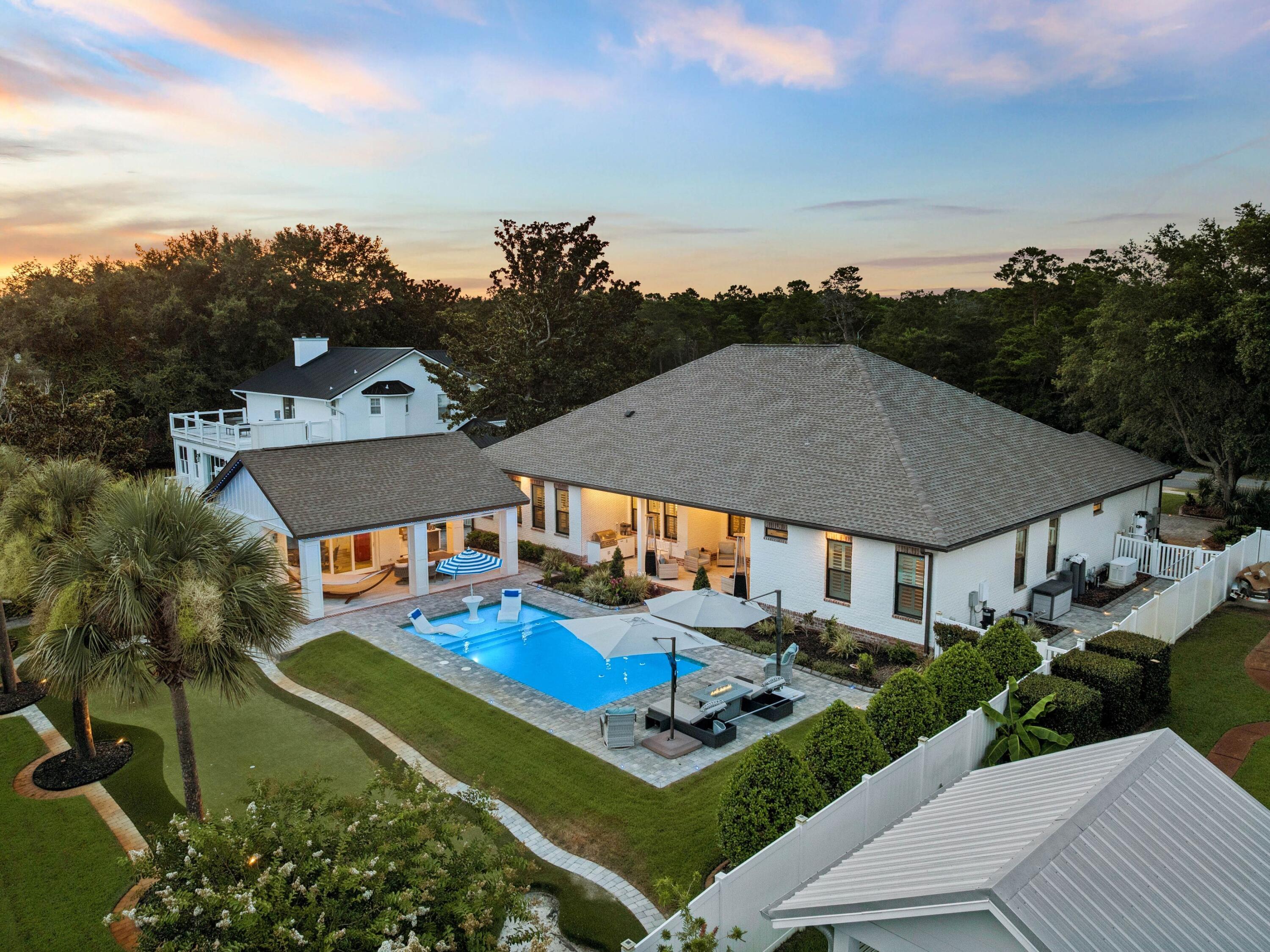 Every element of this extensively renovated waterfront residence has been thoughtfully curated to create an exceptional living experience where luxury meets effortless coastal living. Positioned along a quiet deepwater canal with direct access to Choctawhatchee Bay, this turnkey property offers the freedom of boating from your own backyard while remaining just minutes from the area's renowned beaches, golf courses, shopping and dining.

Inside, the open-concept floor plan is designed for both everyday comfort and entertaining on a grand scale. Wide-plank luxury flooring flows throughout the home, connecting spacious living and dining areas centered around a sleek gas fireplace with custom shiplap detailing. The chef's kitchen is equipped with premium Viking appliances and overlooks the main gathering spaces, while five generously sized bedrooms, four full bathrooms, two half baths and a dedicated office provide flexibility for families and guests alike.

The outdoor living spaces rival those of a private resort. A covered lanai with dual oversized ceiling fans, lighting and a fully equipped outdoor kitchen creates the perfect setting for alfresco dining, while the saltwater pool features a Baja shelf, tanning ledge, integrated lighting and expansive paver decking, surrounded by lush landscaping and privacy fencing. Beyond the pool, a custom putting green with chipping areas and a genuine sand trap offers endless recreation day or night thanks to thoughtfully placed accent lighting.

Water enthusiasts will appreciate the private dock, complete with covered boat and jet ski lifts, a 30-amp shore power connection, and an industrial-grade KillerDock cleaning station for effortless days on the water. A detached pool house with its own private entrance, living area, wet bar, and half bath offers exceptional versatility, serving equally well as a private guest retreat, hobby space, or seamless extension of the outdoor living area surrounding the pool.

Additional highlights include an oversized garage with ample room for vehicles and water toys, a whole-yard water softener, Generac generator, tankless water heater, irrigation system, landscape lighting and plantation shutters throughout. With no HOA restrictions and an unmatched combination of premium upgrades, exceptional outdoor amenities and direct boating access, this remarkable waterfront property offers a rare opportunity to enjoy the very best of the Florida lifestyle.