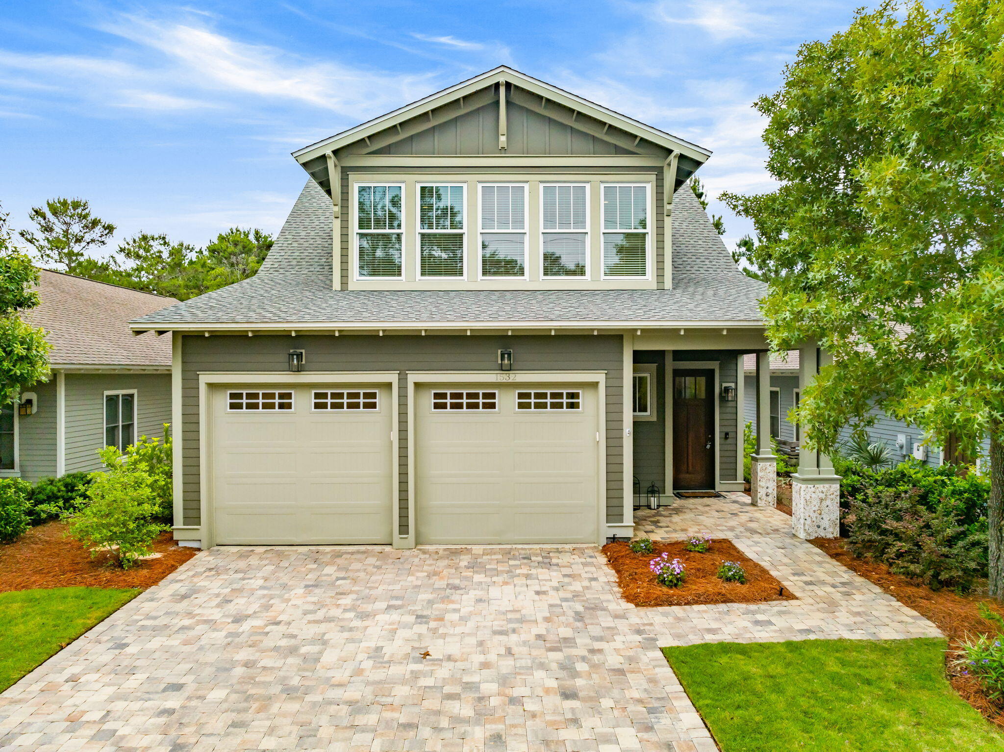 Welcome to luxury living in the heart of Wild Heron. Built in 2024 and impeccably maintained, this like-new 3 bedroom, 3 bathroom home offers exceptional craftsmanship, thoughtful design, and premium upgrades throughout. Situated along the 3rd hole of the renowned Sharks Tooth Golf Course, this home combines elegant interiors with a peaceful golf course setting. Inside, you'll find site finished hardwood floors, abundant natural light, and a bright open-concept floor plan designed for both everyday living and entertaining. The chef's kitchen features upgraded finishes, quartz countertops, custom cabinetry, and a spacious island overlooking the living and dining areas. The flexible floor plan includes a bonus room currently functioning as a butler's pantry and office, with the ability to easily convert back into a 4th bedroom if desired. The spacious primary suite offers a spa-inspired bath and a relaxing retreat feel, while the upstairs bonus living area provides additional space for guests, media, or hobbies. One of the standout features is the incredible amount of heavily insulated attic storage space, offering both energy efficiency and rare functional storage. Outside, enjoy the beautifully landscaped setting and all the amenities Wild Heron is known for, including gated entry, pools, fitness center, dock access to Lake Powell, and scenic walking trails. (Golf & tennis, with Watersound Club Membership). A rare opportunity to own a nearly new luxury home in one of Panama  City Beach's most sought-after gated communities.