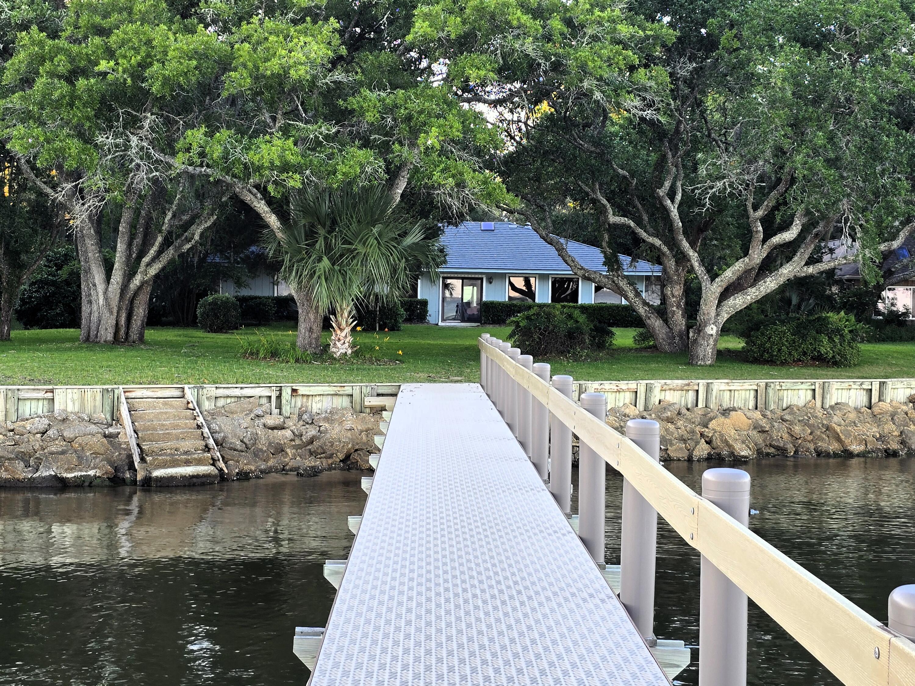 Experience waterfront living with sweeping bay views, a beautifully rebuilt dock, and a setting that makes every morning feel like a getaway. This 3BR/3BA, 3,276 SF bayfront home sits on 0.80 acres and features a private Mother-in-Law Suite with its own entrance, kitchenette, full bath, and walk-in closet - ideal for guests or multigenerational living.

Inside, enjoy cathedral ceilings, skylights, spacious living areas, and a bright sunroom overlooking the water that brings the outdoors in year-round. The kitchen features a Jenn-Air smooth top stove, island with breakfast bar, and stainless/black appliances designed for everyday function and entertaining.

Outdoor living is where this property truly shines, with a beautifully rebuilt dock featuring composite decking and concrete pilings, a raised seawall for added elevation, and wide-open bay views made for sunset evenings and coastal relaxation.

Additional highlights include a metal roof, hurricane shutters, and a 2-car garage. Conveniently located minutes to Niceville, Destin, Hwy 331, top-rated schools, medical facilities, shopping, and dining.

A rare opportunity to own a true bayfront retreat offering space, flexibility, and the coastal lifestyle you've been waiting for.