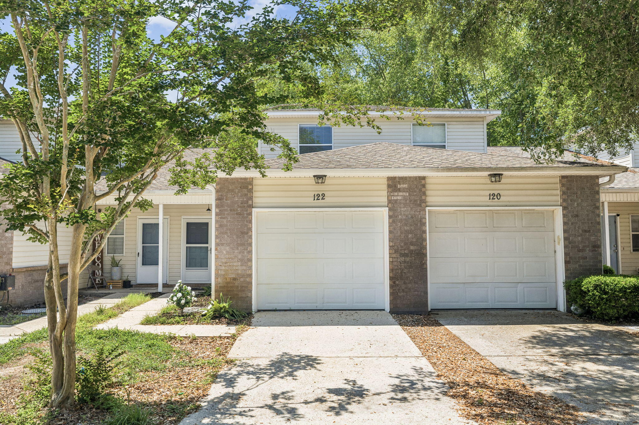 MOVE-IN READY and just minutes from Hurlburt Field. Recently re-established HOA with FINANCING NOW AVAILABLE. This 3-bedroom, 2-bath condo is tucked away in a quiet community with only six units, offering a peaceful and secluded setting rarely found this close to town. Surrounded by wooded natural habitat areas in a mostly rural, non-subdivision location, you'll enjoy the tranquility of nature along with the sounds of birds and passing tugboats from the nearby Intracoastal Waterway. Friendly neighbors and a quiet atmosphere make this property feel like a hidden retreat. Inside, the home features fresh paint throughout, tile floors throughout the first floor and both bathrooms, new carpet upstairs, with a functional layout ideal for everyday living. The downstairs primary suite includes an adjacent full bath, while upstairs offers two additional bedrooms and a second full bath. The unit includes washer/ dryer attachment locations and a one car garage. HOA dues include Insurance and management fees.
