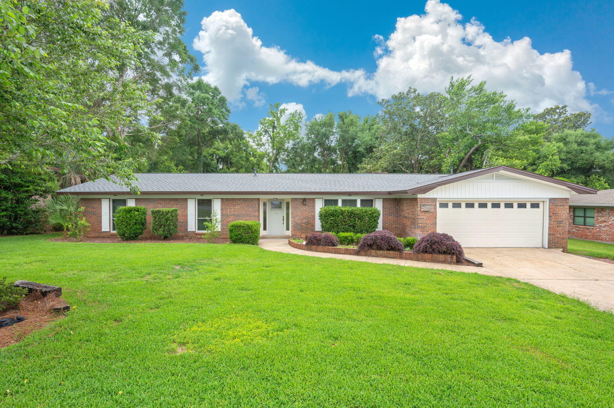 Welcome to Poquito Bayou, one of the area's most desirable communities! Conveniently located near Eglin AFB, Hurlburt Field, and the VA Clinic, this lovingly maintained all-brick home offers space, comfort, and an exceptional lifestyle. Step inside to a welcoming foyer that opens to a bright and spacious living room filled with natural light from large picture window. The living room flows seamlessly into the Bonus Room/Office. The large open dining room /kitchen area is the perfect setting for entertaining family and friends. The beautifully updated kitchen features granite countertops, a breakfast bar, ample cabinetry, and plenty of workspace for meal preparation. Need room to spread out? This home offers two separate living areas, including a large family room with a cozy fireplace and direct access to the backyard. A convenient half bath off the family room. Laundry area is conveniently located inside. Recent improvements include new cellulose insulation installed in 2025 for enhanced energy efficiency. Roof 2023,  AC and Duct Work 2022,  Tankless Water Heater 2023, New Wiring 2020, Vinyl Windows 2021,  Outside, you'll discover a lush, oversized backyard designed for enjoying Florida living. Relax under the pavilion complete with electricity for cozy evenings, cultivate your favorite vegetables in the raised garden bed, or take advantage of the impressive 16' x 20' powered storage building/workshop. Additional exterior features include a gas stub for grilling,(con't) a concrete pad for additional storage options. Enjoy everything Poquito Bayou has to offer, including nearby parks with water access, and a wonderful community atmosphere that holds events for special occasions. This well-cared-for home is a RARE opportunity to enjoy a spacious lot, thoughtful updates, and an unbeatable location. Buyer to verify all measurements and information Roof