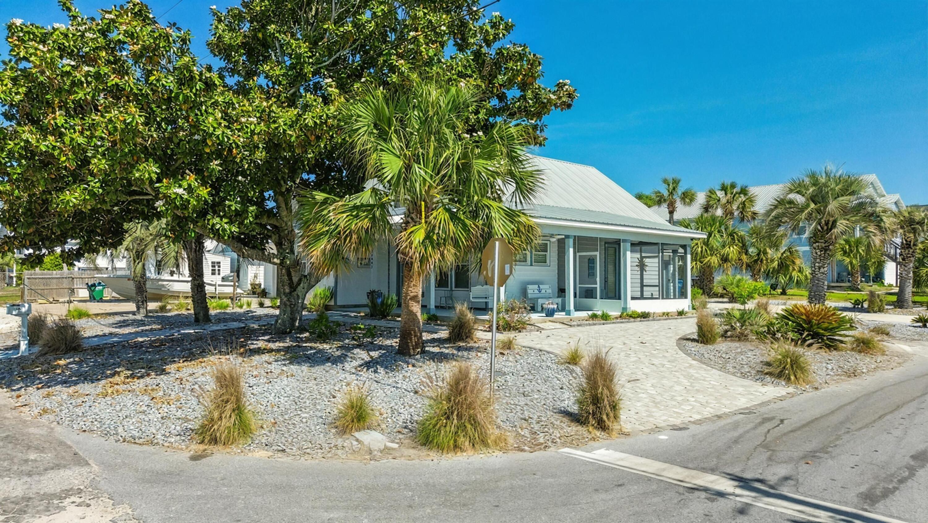 2022 Build Just 500ft to Laguna Beach! Claim your piece of paradise in the highly coveted Laguna Beach community! This stunning 2022-built residence sits on a prime corner lot just steps from an ADA beach access. Perfectly positioned on the quiet West End, this home is Short-Term Rental friendly, making it a premier choice for a lucrative investment or a high-end coastal retreat. The interior features a seamless open-concept floor plan accented by durable, beach-friendly LVP flooring and modern finishes throughout. This property is being offered fully furnished, allowing for a truly turnkey transition. The exterior is designed for the coastal lifestyle, featuring a two-car garage (a rare find in Laguna!) and dedicated room for golf cart parking. After a morning on the white sands, rinse off in the private outdoor shower. With 2022 construction, you'll enjoy the peace of mind that comes with modern building codes, impact-rated features, and energy efficiency. Located just minutes from Pier Park and 30A, but tucked away in the golf-cart-friendly atmosphere of Laguna Beach. No HOA fees! Schedule your private showing today and start living the PCB dream.
