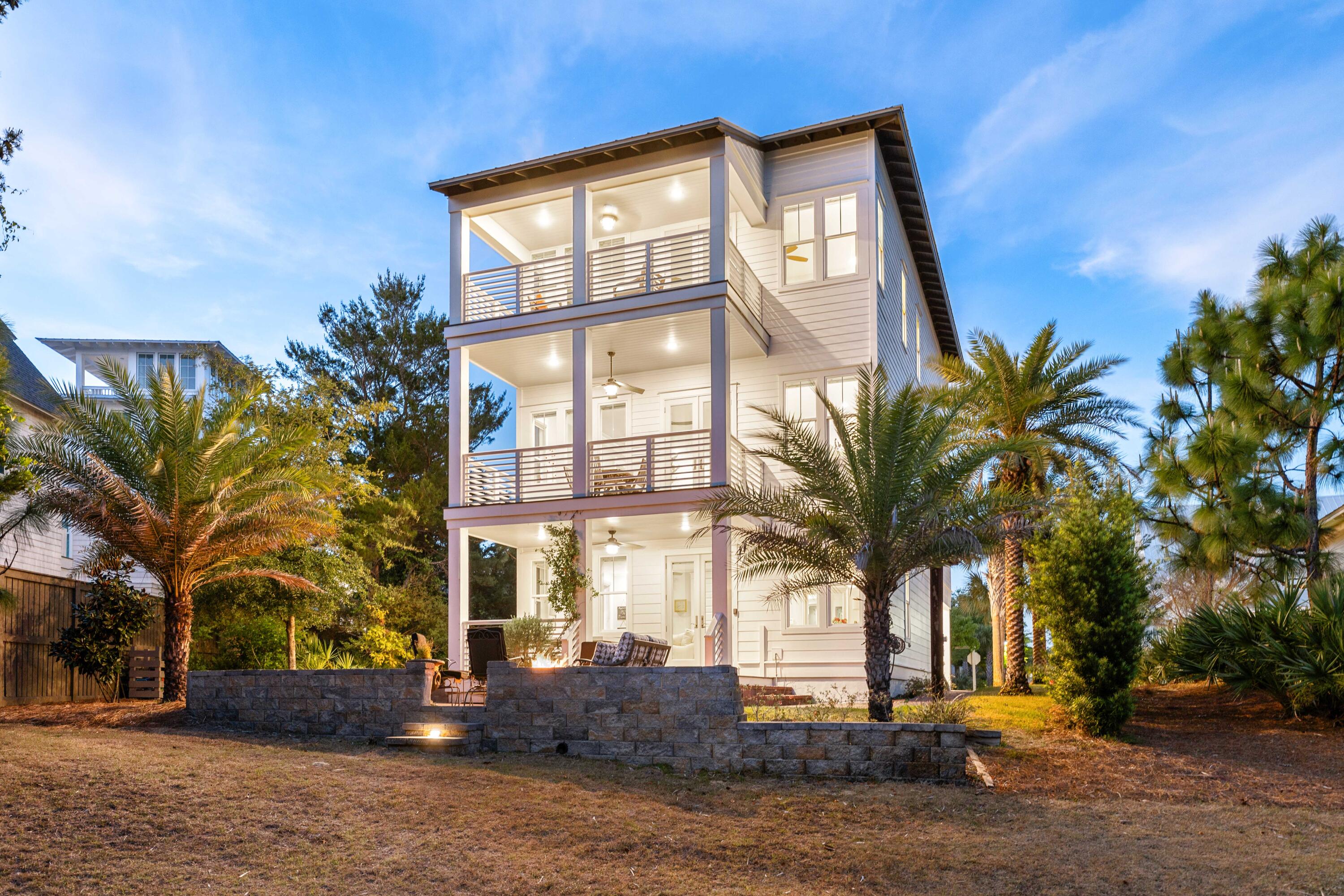 Perfectly positioned south of 30A at the end of a quiet cul-de-sac in Prominence, this coastal retreat offers the ideal blend of privacy, flexibility, and walkable beachside living. Just moments from the Gulf and a short walk or bike ride to The Big Chill, you're in the heart of one of 30A's most vibrant lifestyle hubs.

This 4BR/3.5BA home features a reverse floor plan with dual primary suites and a lockout design with a secondary kitchen--offering exceptional flexibility for guests or income-producing opportunities.

Enjoy three covered porches, a private courtyard with fire pit and gas lanterns, plus parking for up to five vehicles. Offered furnished with exclusions.