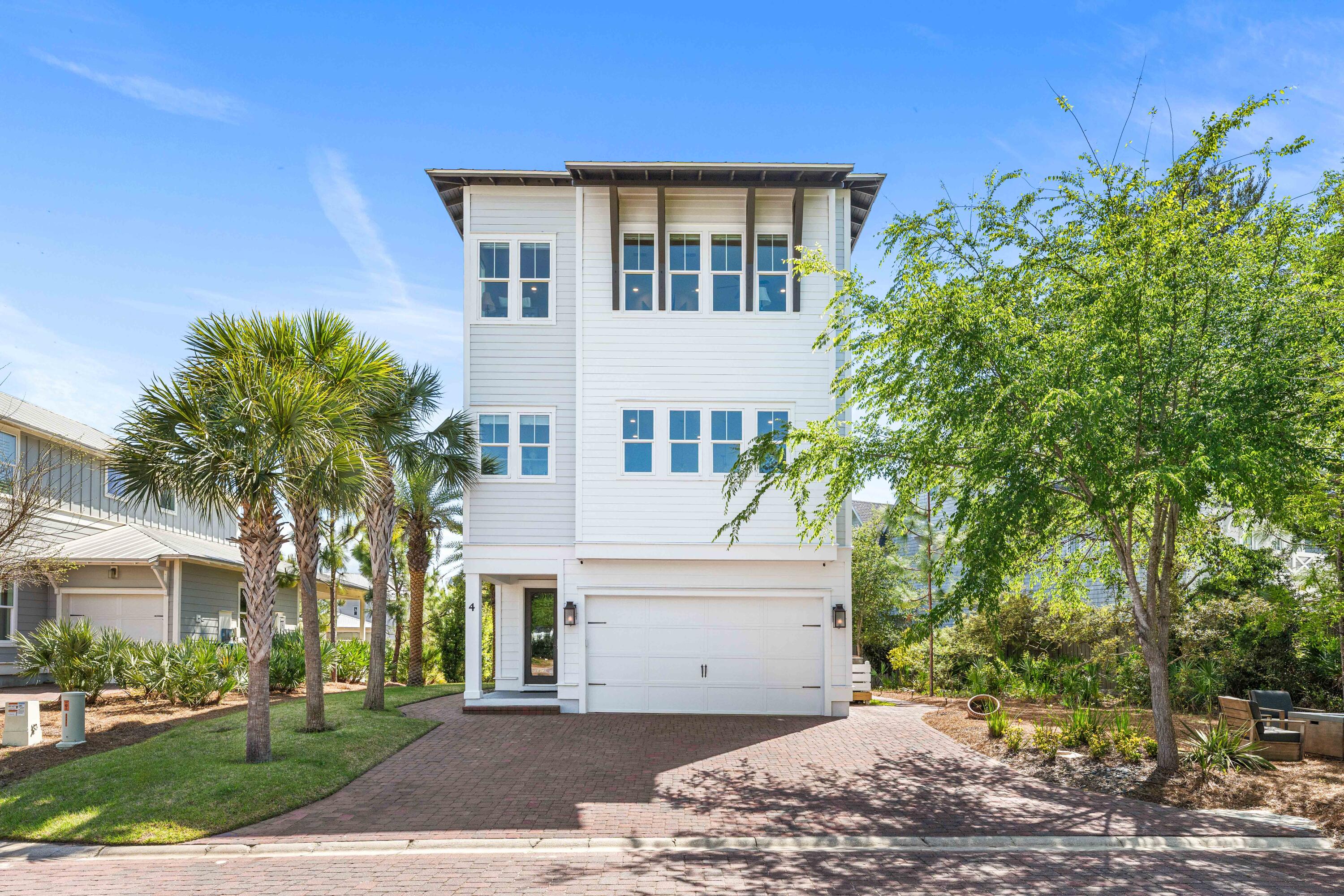Perfectly positioned south of 30A at the end of a quiet cul-de-sac in Prominence, this coastal retreat offers the ideal blend of privacy, flexibility, and walkable beachside living. Just moments from the Gulf and a short walk or bike ride to The Big Chill, you're in the heart of one of 30A's most vibrant lifestyle hubs.

This 4BR/3.5BA home features a reverse floor plan with dual primary suites and a lockout design with a secondary kitchen--offering exceptional flexibility for guests or income-producing opportunities.

Enjoy three covered porches, a private courtyard with fire pit and gas lanterns, plus parking for up to five vehicles. Offered furnished with exclusions.