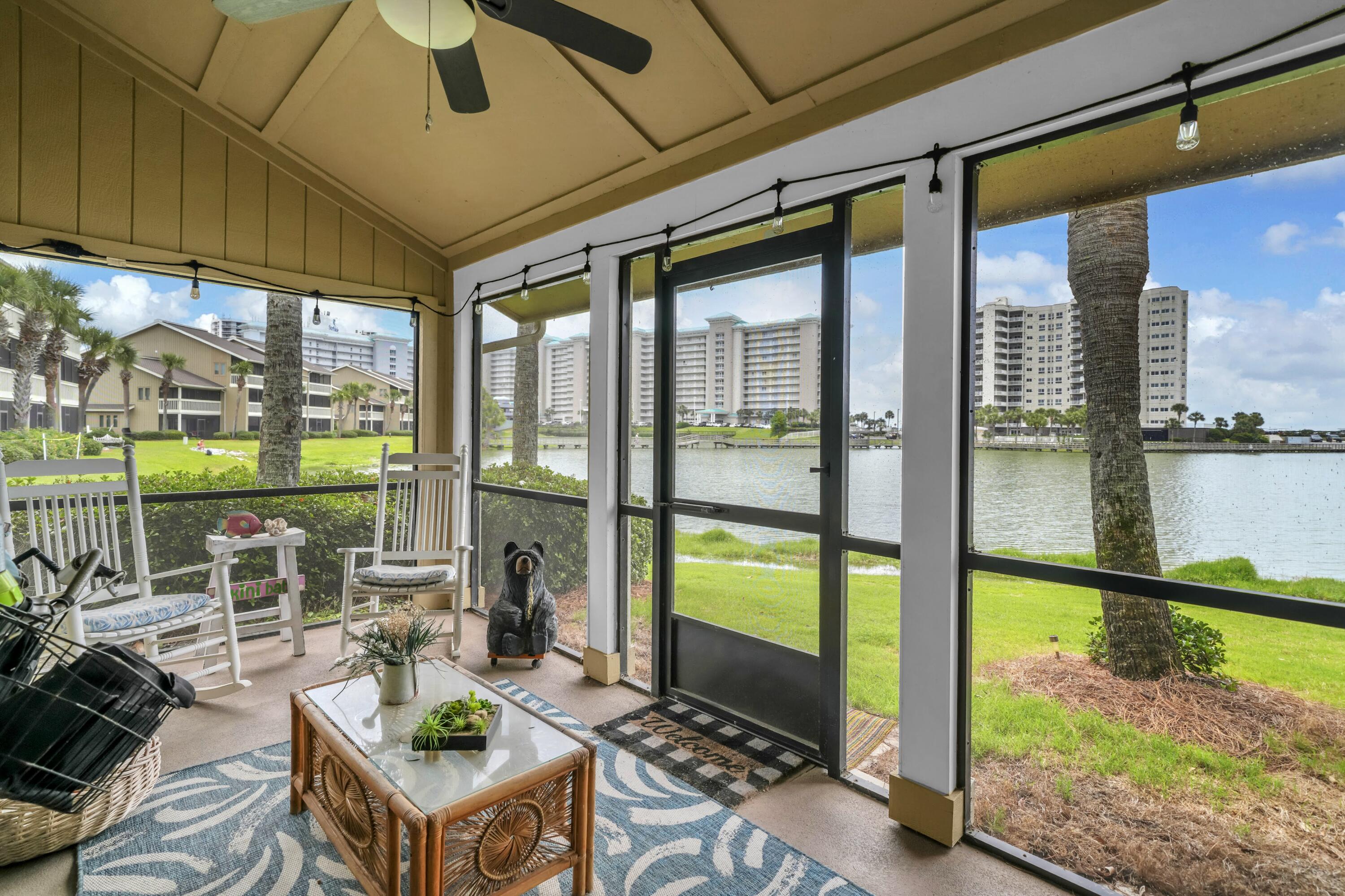 Opportunity isn't just knocking - it's here! Welcome to one of the rarest offerings within Seascape Resort. This exceptional ground-floor residence is one of only two condos in the entire complex featuring this highly sought-after floor plan.

Spanning 1,782 square feet, this beautifully maintained end-unit offers 3 spacious bedrooms, 3 full bathrooms, and an ideal blend of comfort, functionality, and coastal living. Rich wood flooring runs throughout the home, complemented by abundant storage and a spacious layout designed for effortless everyday living and entertaining.

The true showpiece of the property is the oversized screened patio extending across both the living area and primary suite, creating a seamless indoor-outdoor living experience with peaceful water views. Whether enjoying a quiet morning coffee or unwinding at sunset, this private retreat offers the perfect setting year-round.

As a premium end-unit, the condo provides added privacy and natural light, while the thoughtfully positioned primary suite enjoys the rare benefit of having no unit directly above. The suite also features private patio access and a beautifully updated bath with a zero-entry shower and frameless glass enclosure. Each bedroom is paired with its own full bathroom, making this property exceptionally versatile as a primary residence, second home, or vacation rental investment. Ownership within Seascape Resort includes access to golf, tennis and pickleball courts, multiple swimming pools, scenic walking paths, deeded beach access to the Emerald Coast's sugar-white sand beaches, a private owner's entrance, plus the resort's popular amphitheater - home to concerts and events throughout the year. Additionally, all HOA inspections have been completed and there are no pending special assessments! Dues are relatively low for all you get at around $840/monthly. 

Properties with this layout and location rarely become available. Whether you're searching for a full-time coastal residence, vacation retreat, or investment opportunity, this is truly a special offering. Schedule your private showing today. A video tour is also available