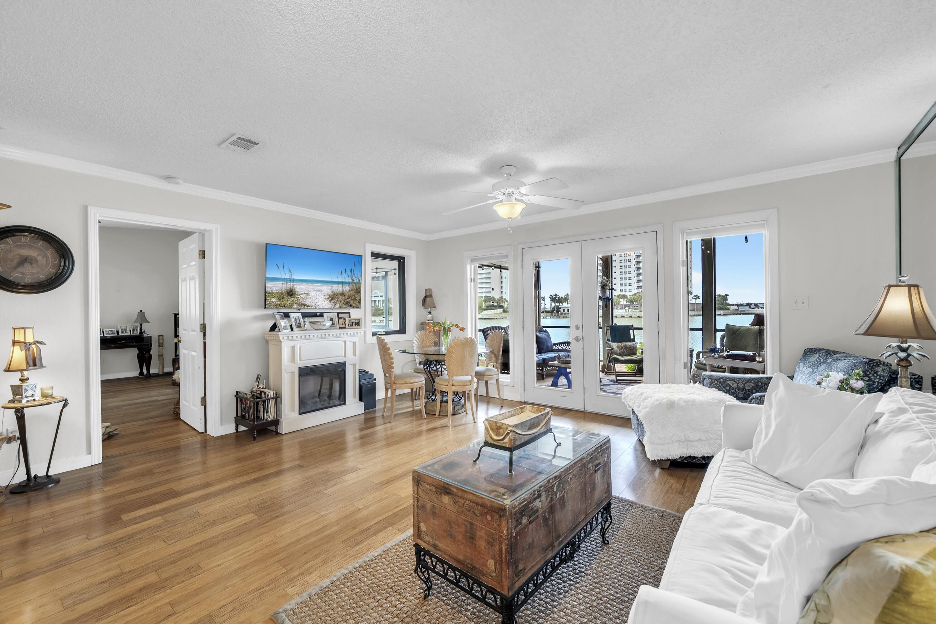 Opportunity isn't just knocking - it's here! Welcome to one of the rarest offerings within Seascape Resort. This exceptional ground-floor residence is one of only two condos in the entire complex featuring this highly sought-after floor plan.

Spanning 1,782 square feet, this beautifully maintained end-unit offers 3 spacious bedrooms, 3 full bathrooms, and an ideal blend of comfort, functionality, and coastal living. Rich wood flooring runs throughout the home, complemented by abundant storage and a spacious layout designed for effortless everyday living and entertaining.

The true showpiece of the property is the oversized screened patio extending across both the living area and primary suite, creating a seamless indoor-outdoor living experience with peaceful water views. Whether enjoying a quiet morning coffee or unwinding at sunset, this private retreat offers the perfect setting year-round.

As a premium end-unit, the condo provides added privacy and natural light, while the thoughtfully positioned primary suite enjoys the rare benefit of having no unit directly above. The suite also features private patio access and a beautifully updated bath with a zero-entry shower and frameless glass enclosure. Each bedroom is paired with its own full bathroom, making this property exceptionally versatile as a primary residence, second home, or vacation rental investment. Ownership within Seascape Resort includes access to golf, tennis and pickleball courts, multiple swimming pools, scenic walking paths, deeded beach access to the Emerald Coast's sugar-white sand beaches, a private owner's entrance, plus the resort's popular amphitheater - home to concerts and events throughout the year. Additionally, all HOA inspections have been completed and there are no pending special assessments! Dues are relatively low for all you get at around $840/monthly. 

Properties with this layout and location rarely become available. Whether you're searching for a full-time coastal residence, vacation retreat, or investment opportunity, this is truly a special offering. Schedule your private showing today. A video tour is also available