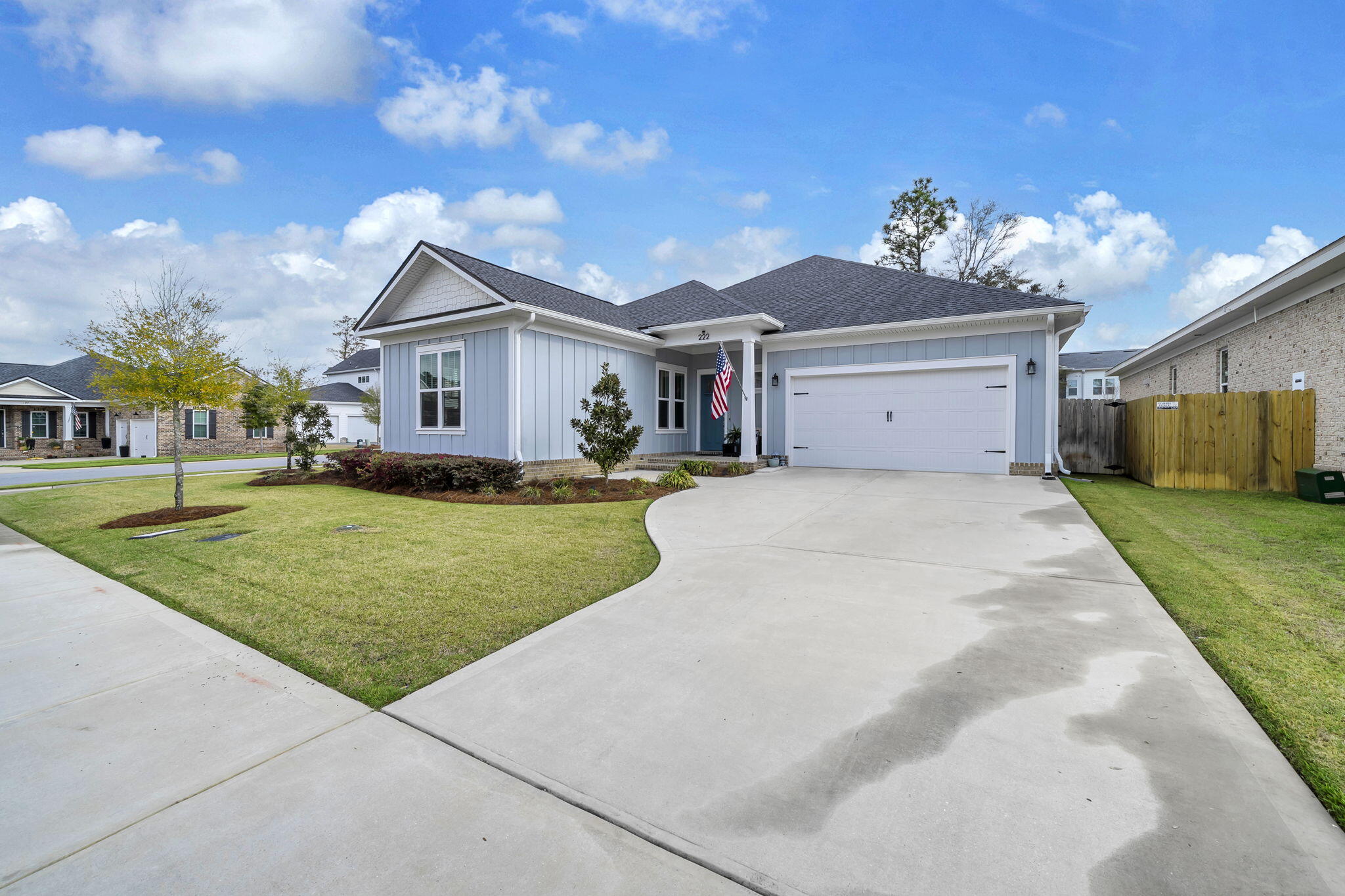 PRISTINE home in Deer Moss Creek Niceville boasting 4 bedrooms, 2.5 baths, situated on a corner lot! The foyer greets you with board and batten walls and takes you to a half bath and drop zone area to your right and three large bedrooms and a full bath to your left. Further in the home you'll find the large, living room w/ gas fireplace and custom mantle. The LR flows easily to the kitchen with lots of cabinet and countertop space and a large island! You'll love the butler's pantry with wood shelving and a handy pass-through door from the garage for ease of handing through your groceries! Right next to the kitchen and off the LR is a sunny dining area with large windows and French door access to the screened porch. The master suite has a shiplapped, cathedral ceiling with the bathroom Featuring double vanities, soaker tub, walk-in shower and large primary closet with wood shelving. The fully, fenced backyard, has a NEW brick paved patio with 2 HUGE umbrellas with lighting that STAY with the home! Also staying is "L" shaped couch on the patio and the front porch chair, the NEW top of the line refrigerator in the kitchen, the 1.5 year old refrigerator in the garage and the washer and dryer! Just move in and enjoy!