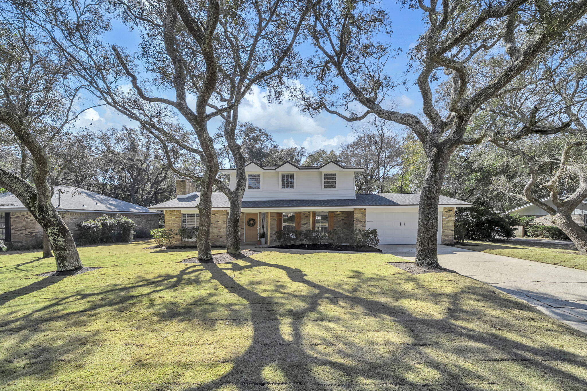 Perfectly positioned beneath mature oak trees in the heart of Poquito Bayou, this completely renovated 4-bedroom, 3-bathroom home blends timeless curb appeal with modern upgrades. Its classic brick exterior and welcoming front porch create a striking first impression, while the spacious lot offers both privacy and room to grow.

Inside, a charming foyer opens to two generous living areas, creating an ideal layout for gathering, entertaining, or relaxing. New luxury vinyl plank flooring flows throughout, leading into the beautifully updated kitchen featuring real wood cabinetry, brand-new stainless steel appliances, updated fixtures, and thoughtful built-ins including custom bookshelves and a wine rack. The adjoining dining room connects seamlessly to a large concrete patio, offering an effortless indoor-outdoor flow that's perfect for hosting.

Cozy up by the fireplace on cooler evenings or envision future gatherings in the expansive backyard, with plenty of space to add a pool and design your own private retreat.
Truly move-in ready, this home showcases fresh interior paint, modern finishes, and fully renovated bathrooms. All three baths have been thoughtfully upgraded with new vanities, toilets, tile work, and fixtures, including new tubs with tiled surrounds upstairs and a glass-enclosed shower downstairs.

For added peace of mind, major system updates include a brand-new roof (2025), full electrical rewire with new panel (2026), new garage door and opener, newer HVAC system (2017), and water heater (2021).

Located within walking distance to the neighborhood playground and public boat launch, and conveniently positioned between Eglin Air Force Base and Hurlburt Field, with the white sandy beaches of Okaloosa Island just a short drive away, this home offers an exceptional balance of work and play.
Space, style, updates, and location  this one truly checks every box.