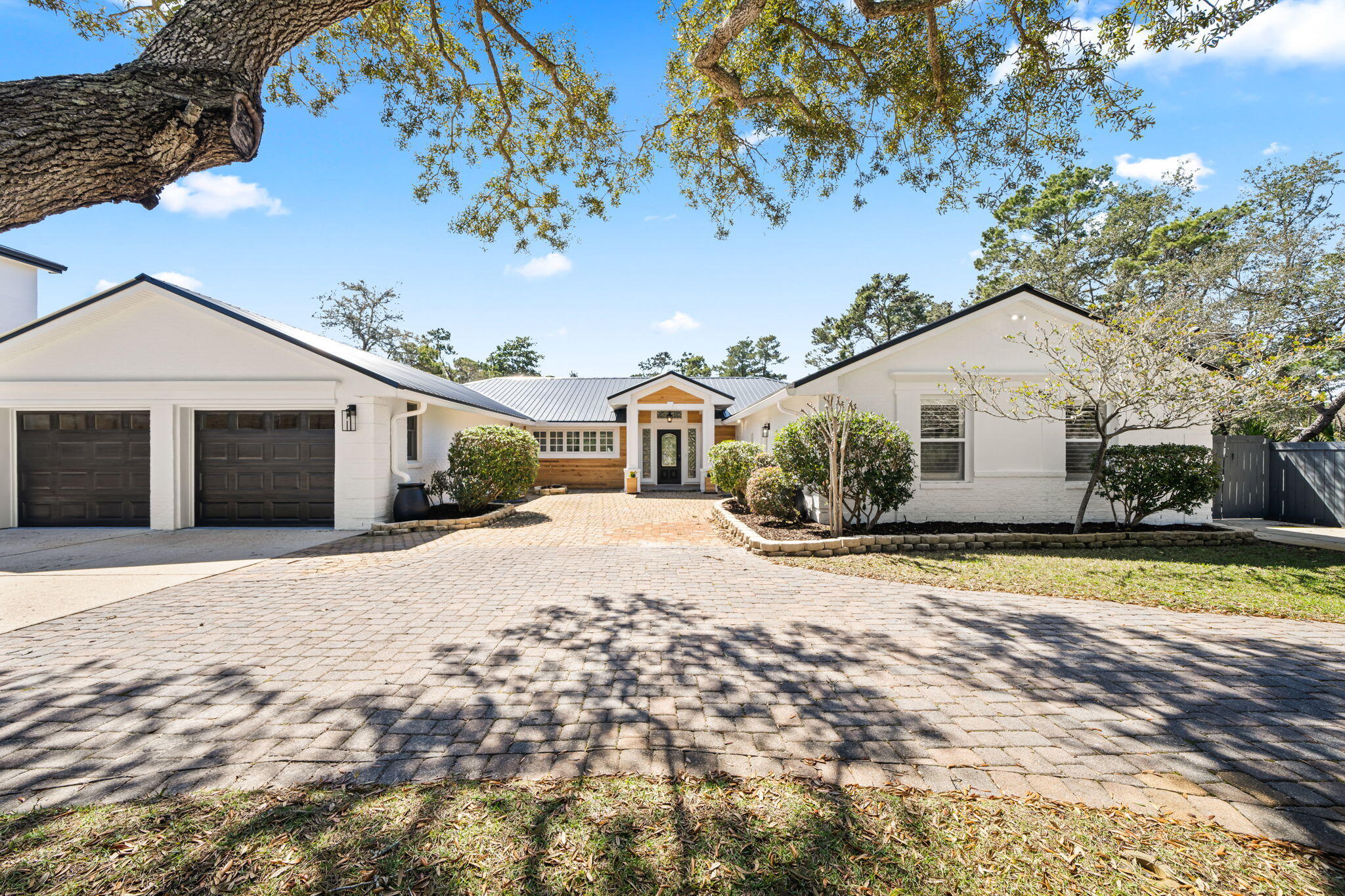 Spacious 4 bedroom, 3 bath ranch-style home with a private pool situated on a full one-acre lot on the quiet street of Walton Way in Miramar Beach. Recently updated with a brand new roof, kitchen, flooring, bathrooms, lighting, and more, providing a fresh and move-in ready interior. Directly across from the bay, this property offers easy access for kayaking, paddleboarding, and enjoying the water. The expansive lot offers privacy and plenty of room for outdoor living and entertaining. Conveniently located near the new park and just minutes from the beaches of South Walton and Destin, as well as shopping and dining. A rare opportunity for space, updates, and bay-side living in Miramar Beach.